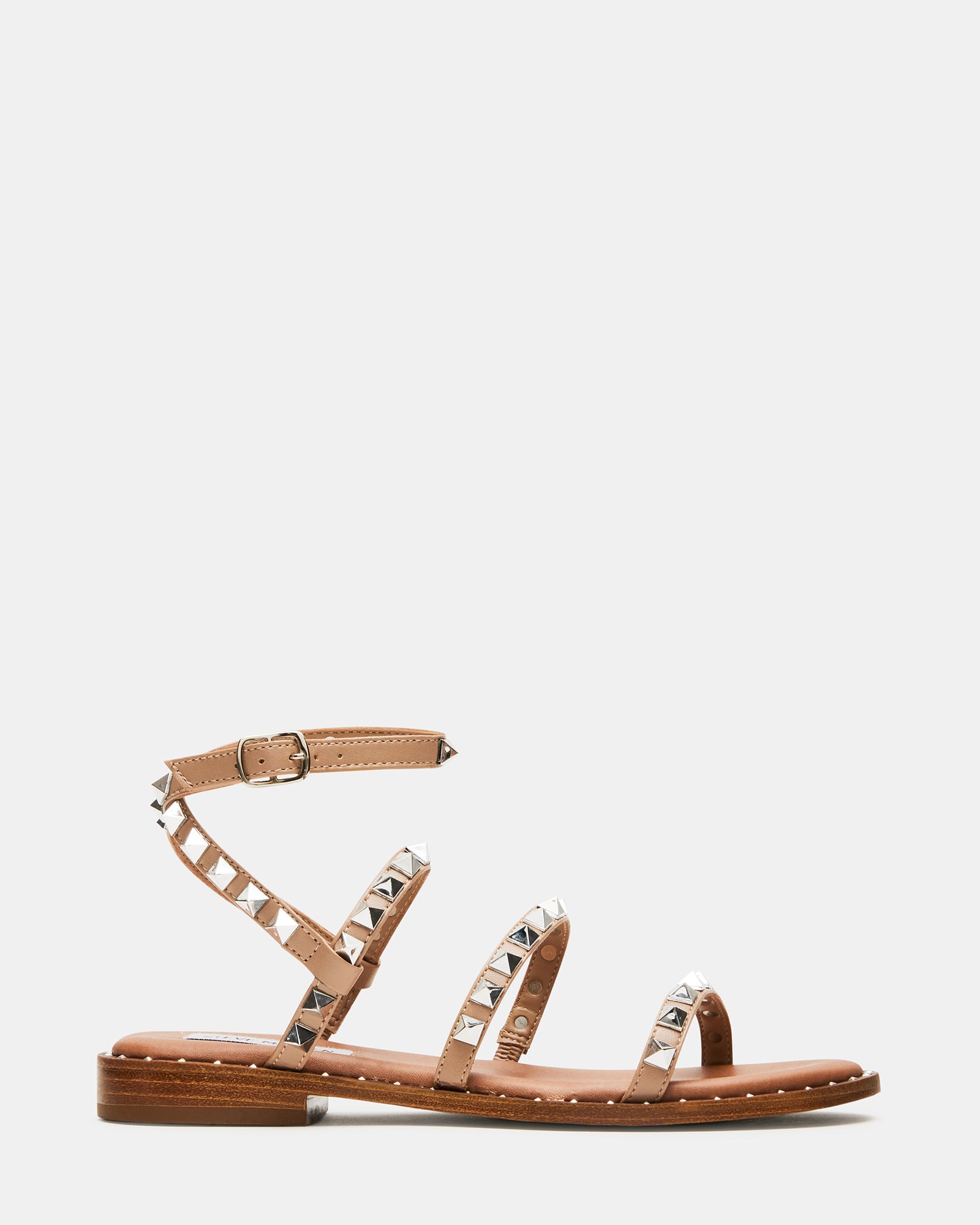 Side view of vegan strappy sandals featuring pyramid studs and a comfortable sole