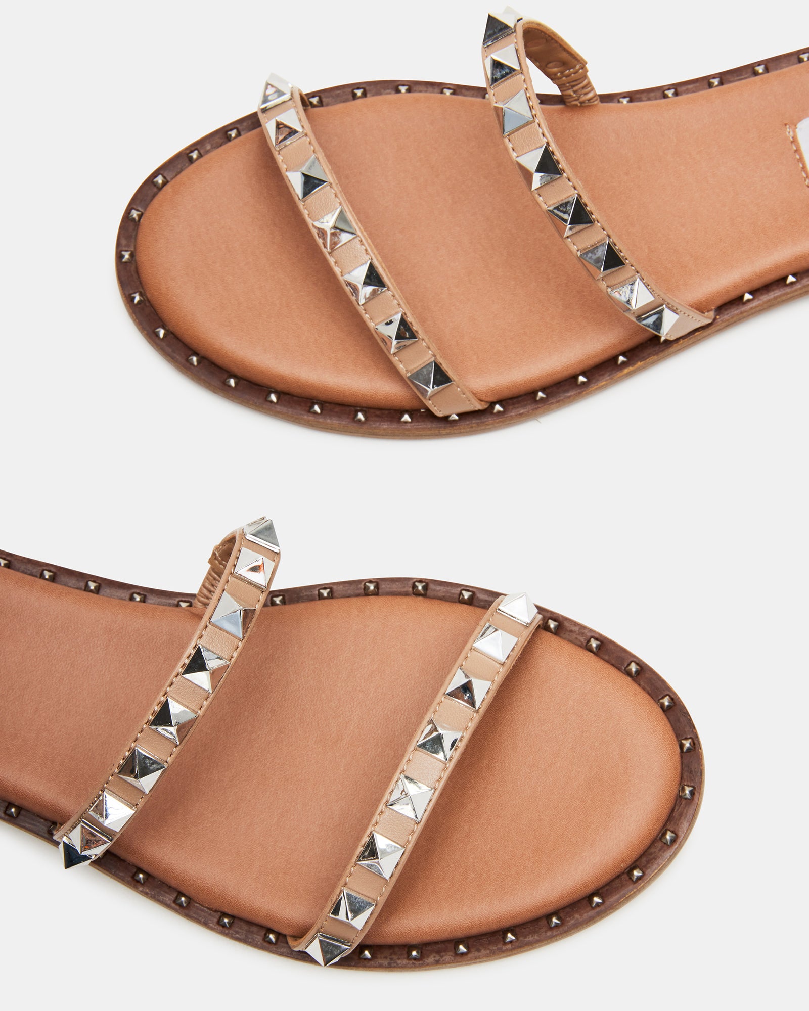 Side view of vegan strappy sandals featuring pyramid studs and a comfortable sole