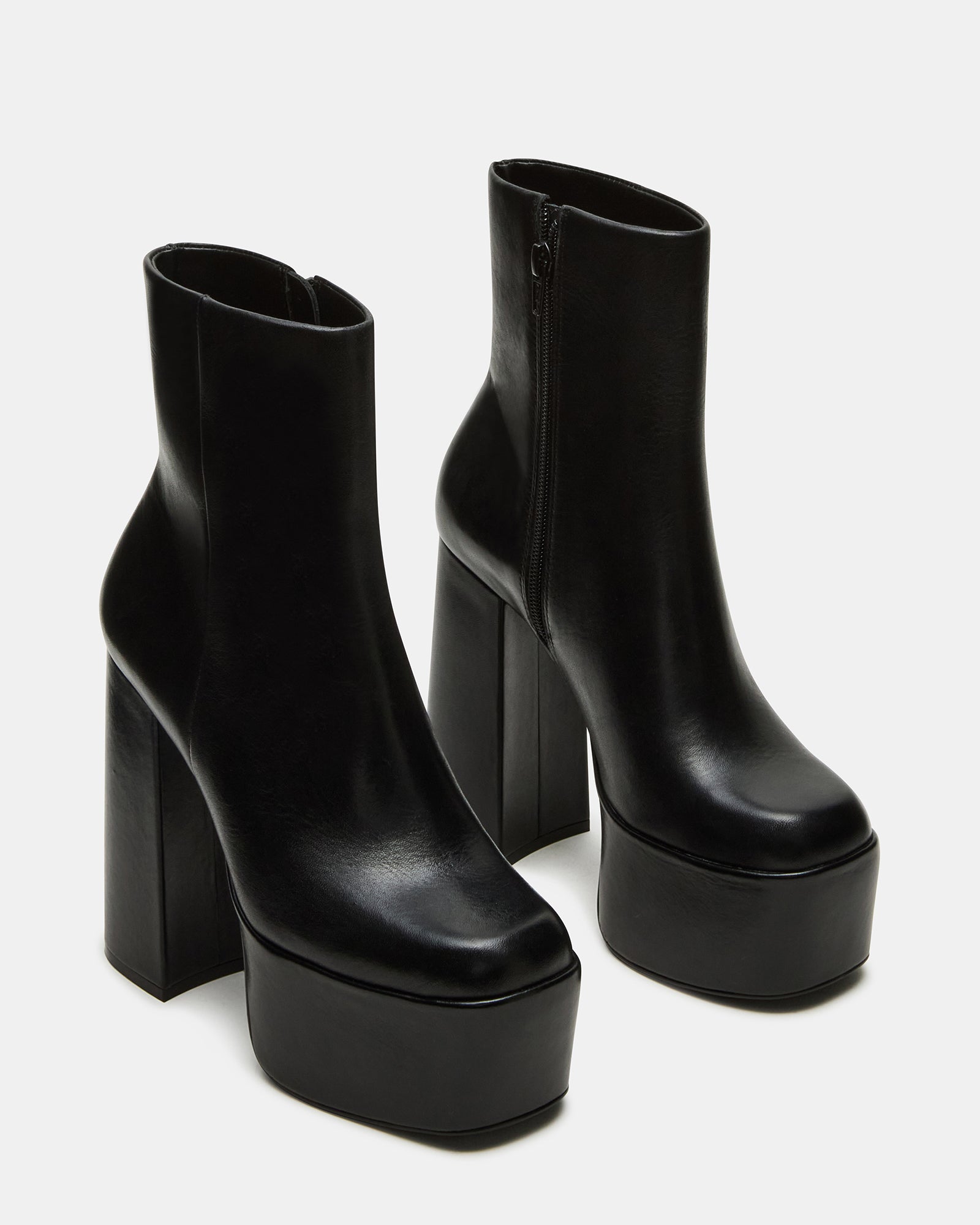 Close-up of the square-toe design on black ankle boots for women.