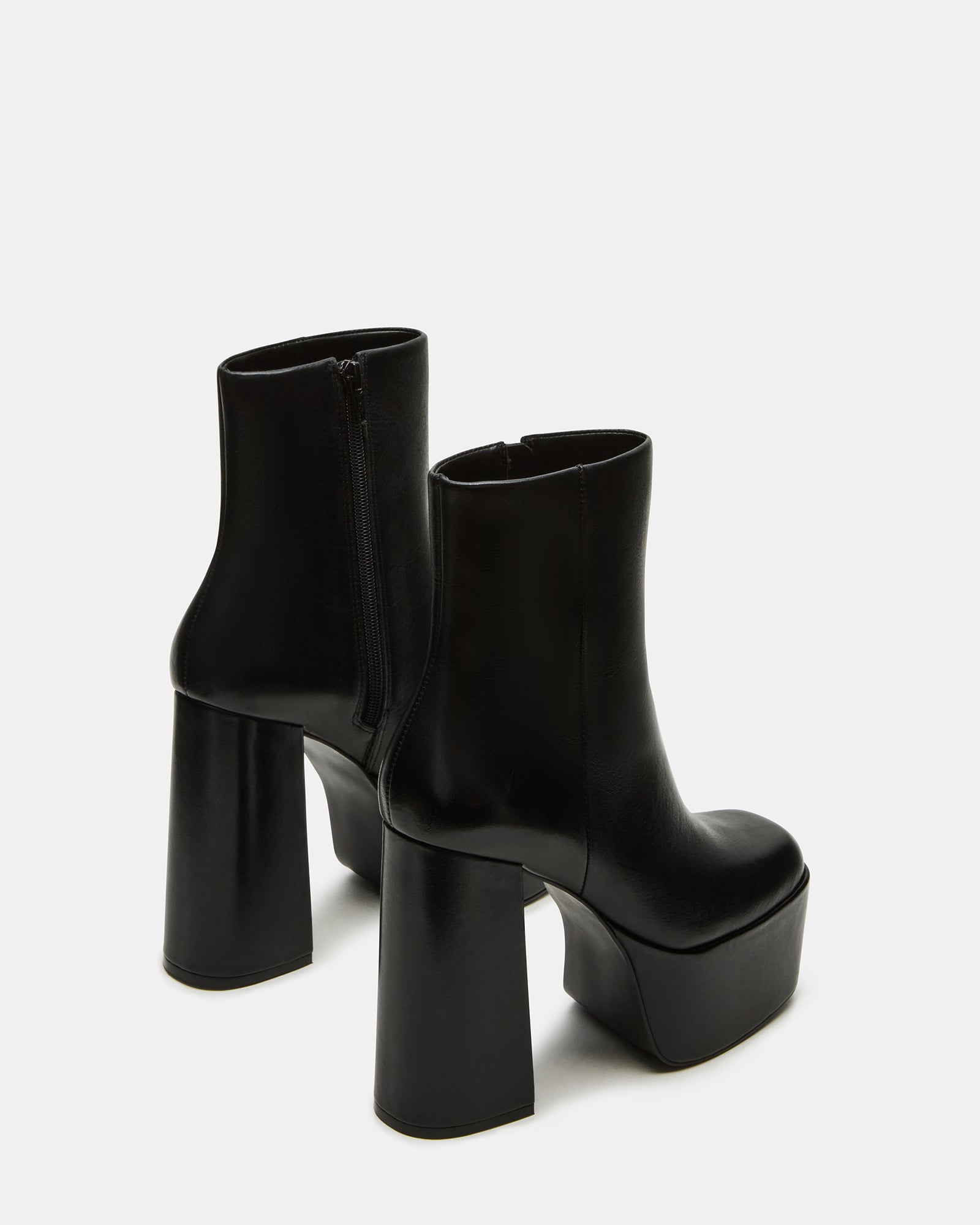 Close-up of the square-toe design on black ankle boots for women.