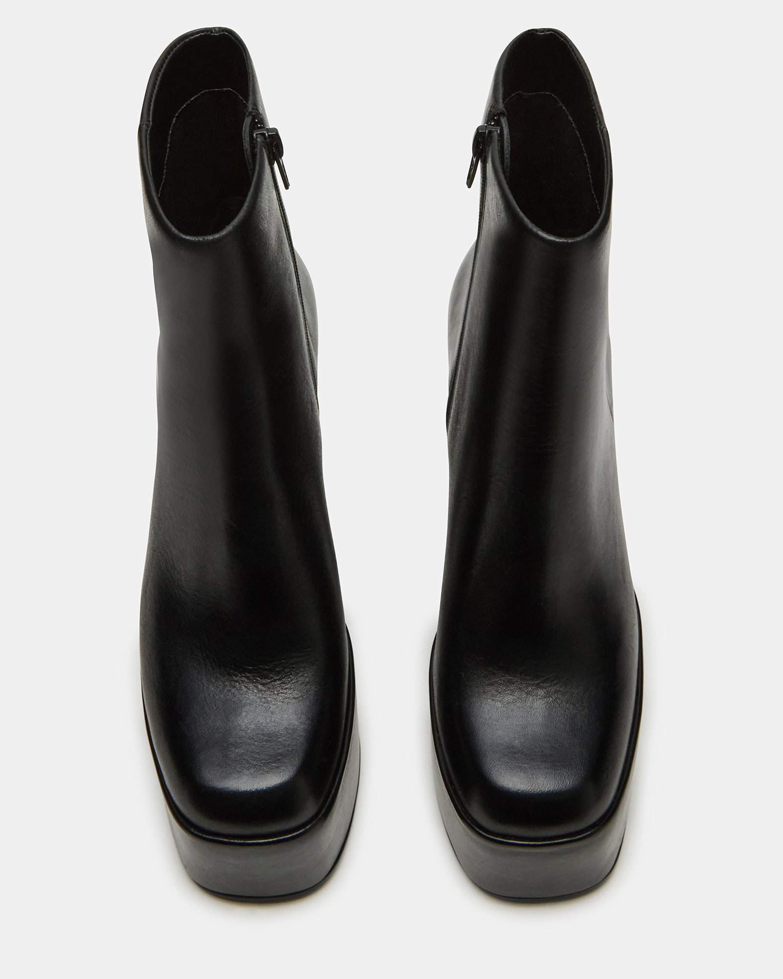 Angled view of Trillion black platform ankle boots showcasing the chunky heel.