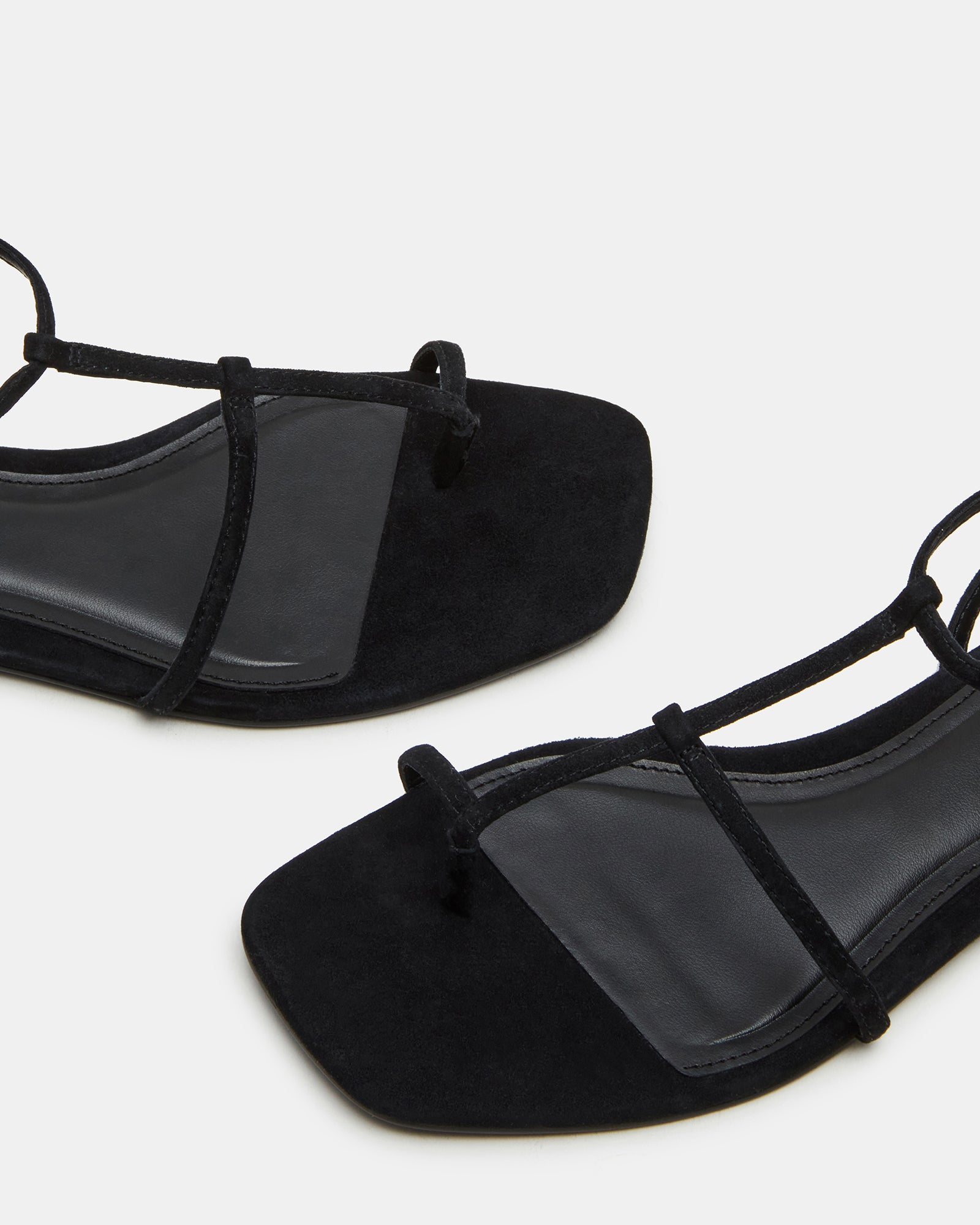 Lifestyle shot of Tropica sandal worn casually during daytime shopping