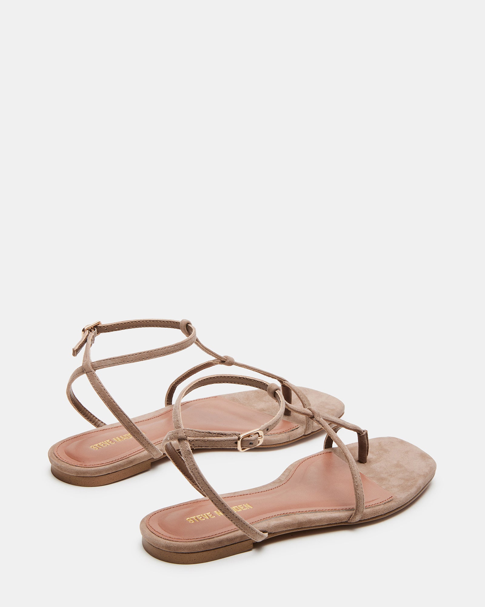 Profile angle of flat sandals women love for both comfort and elegance