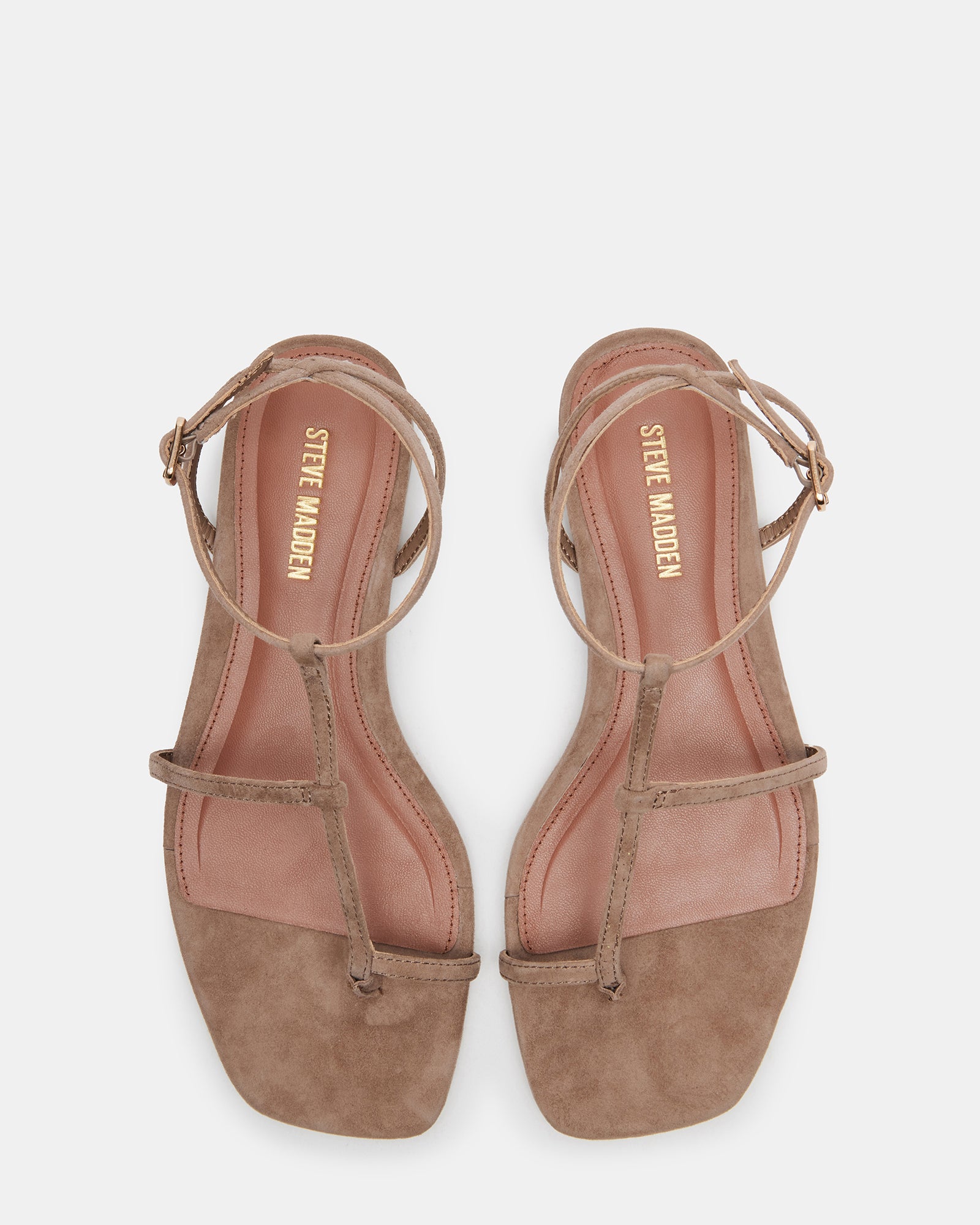 Top-down view of suede sandals showcasing square toe and strap detail