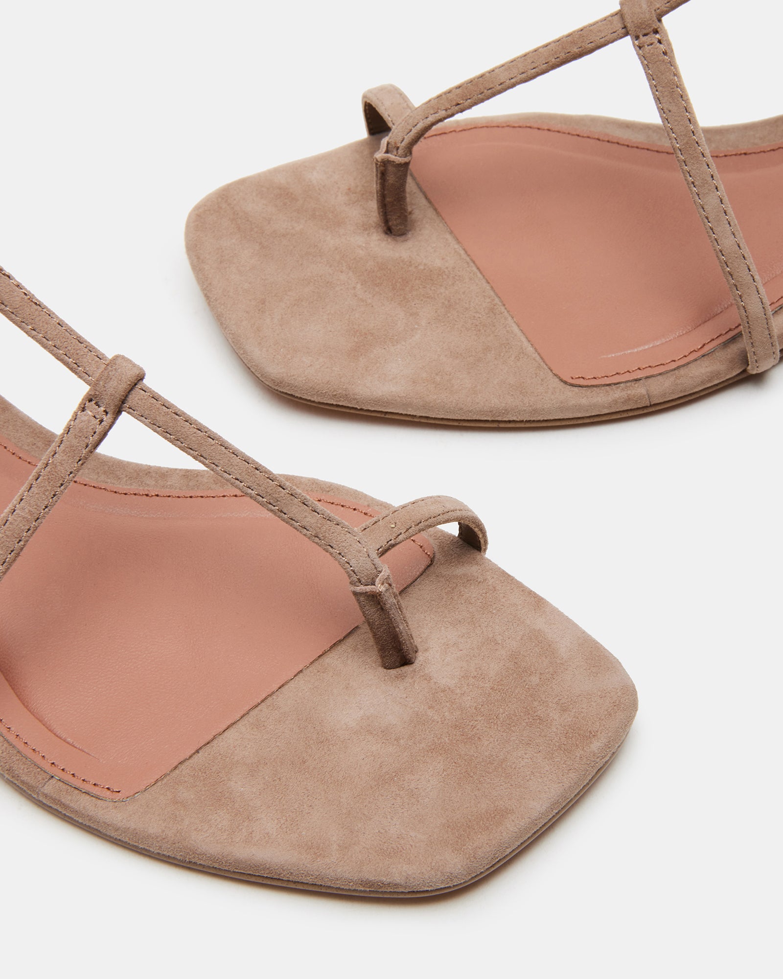 Pair of black flat sandals styled for casual outdoor gatherings