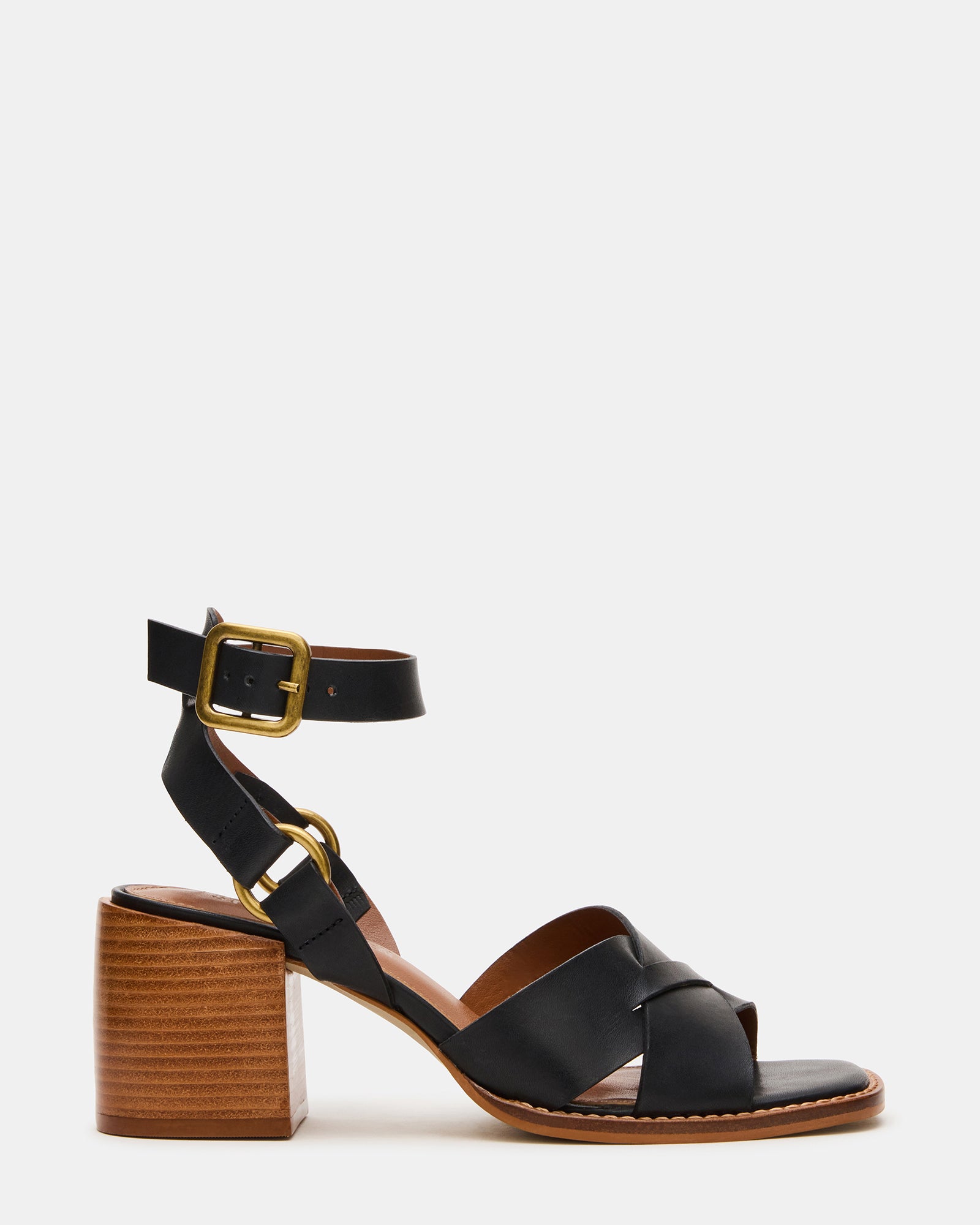Side view of black leather heeled boots with square toe and ankle strap