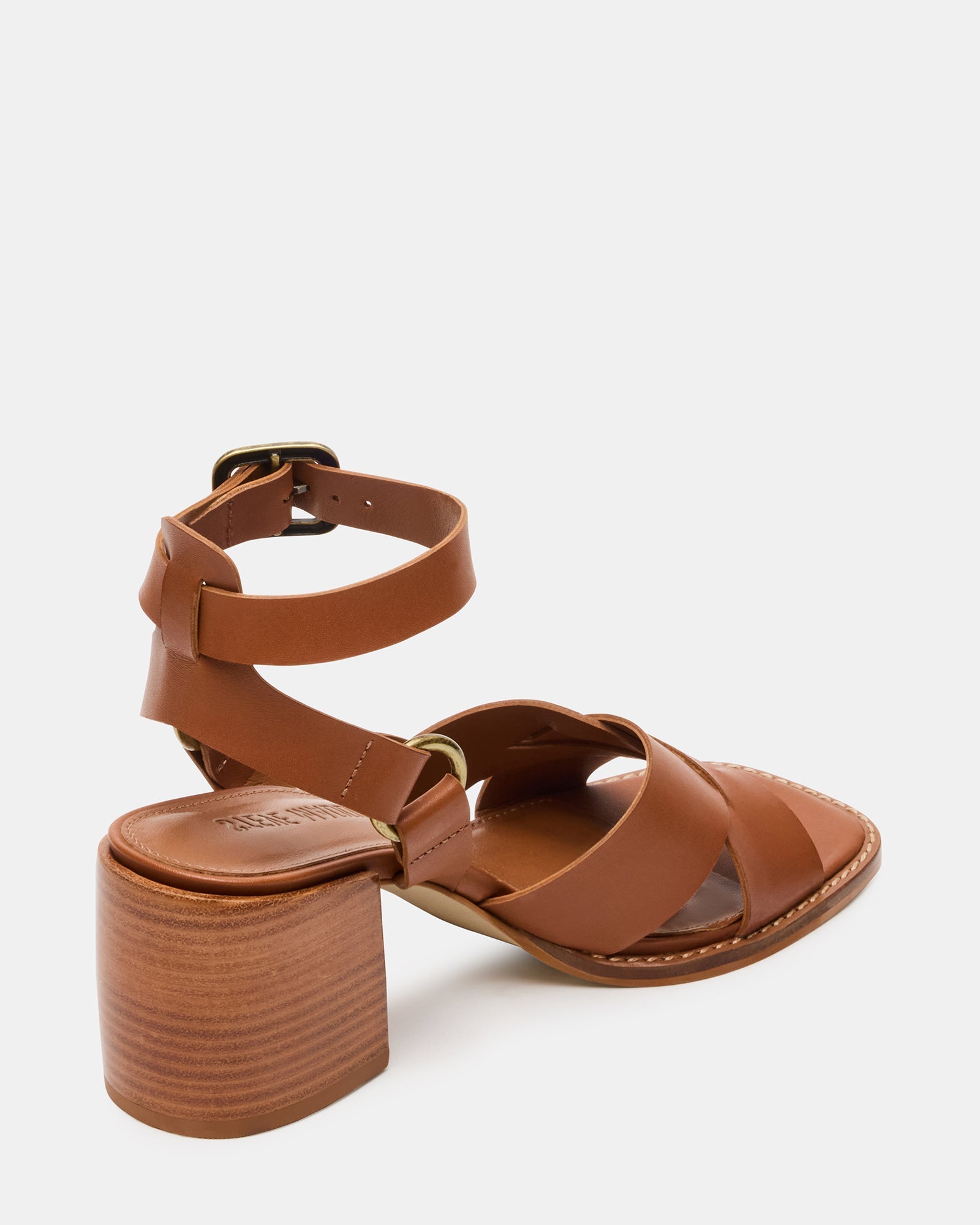 Close-up of square-toe and wood-bottom detail on strappy block heels.