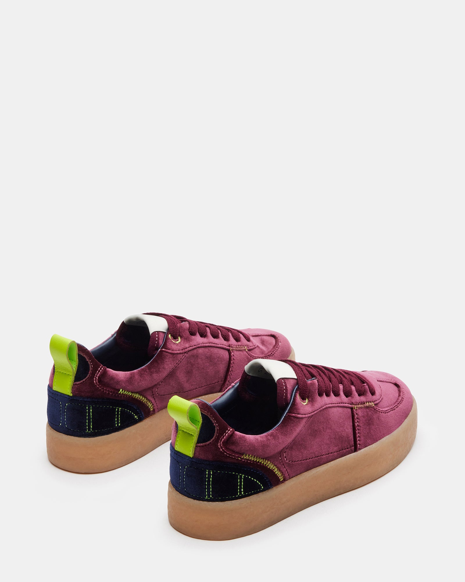 Burgundy Tucker platform sneakers styled with casual outfit.