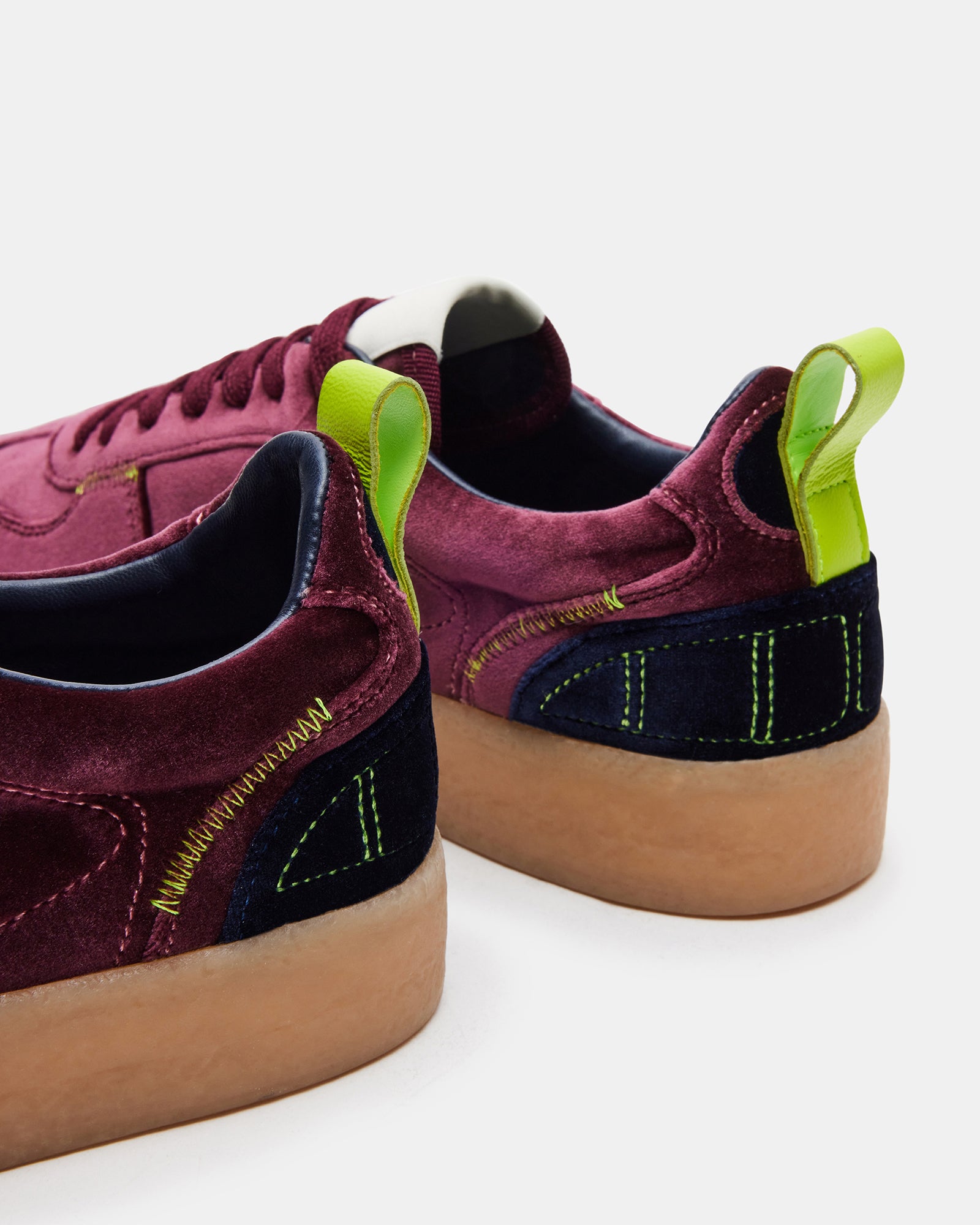 Close-up of Burgundy Tucker platform sneakers showing lace-up detail.