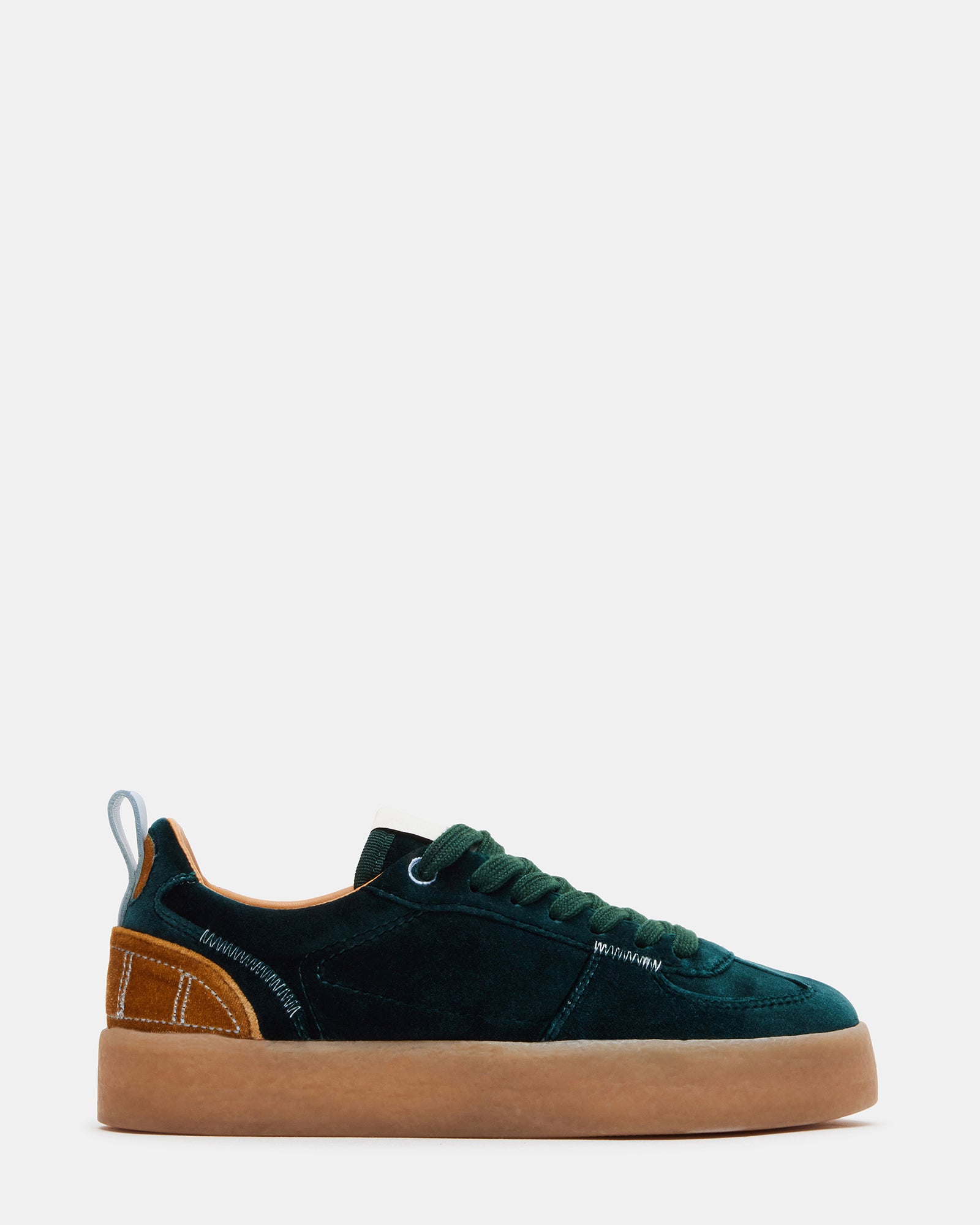 Side view of Tucker Green Multi platform sneakers on a city street