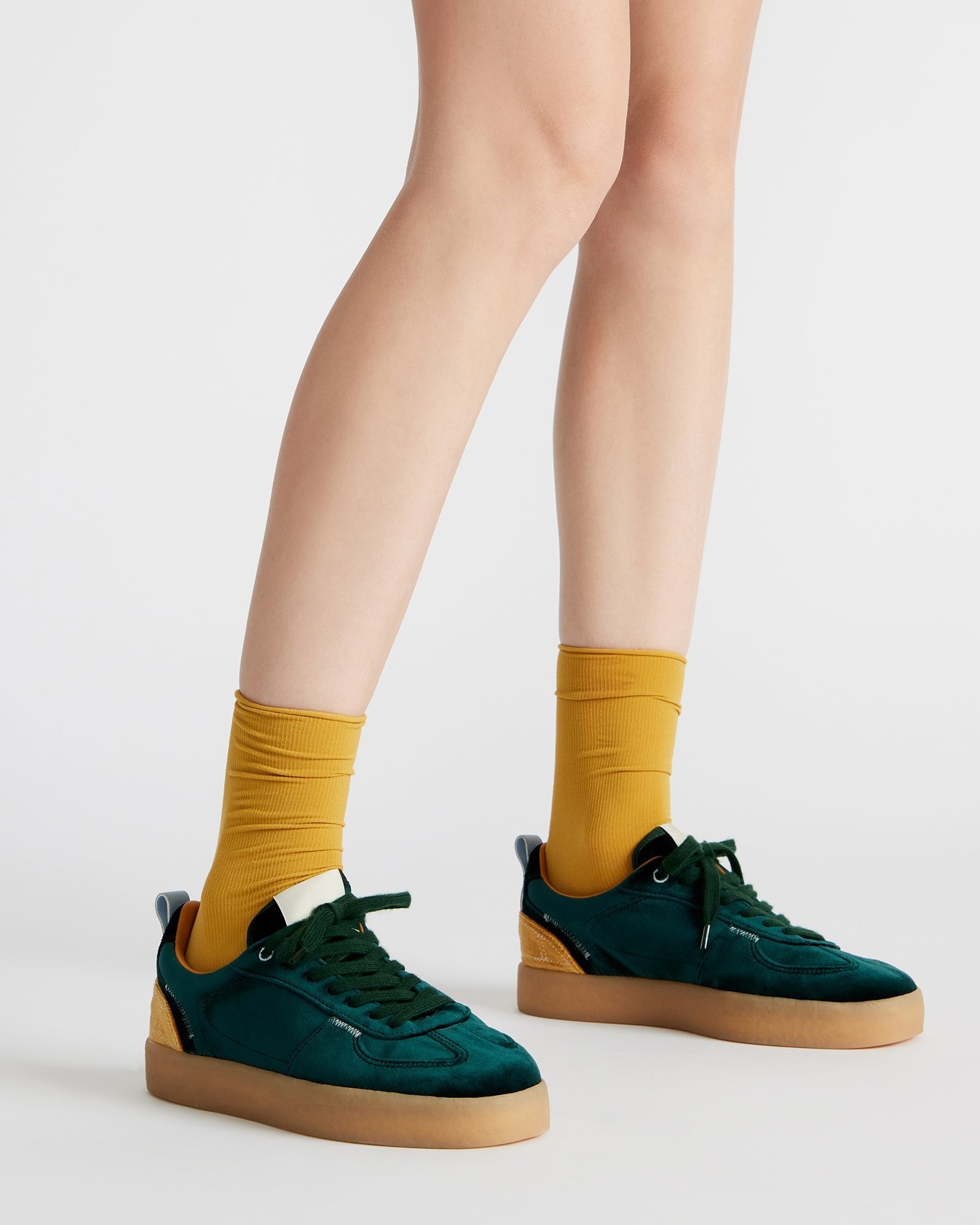 Front shot of trendy black platform sneakers showing the lace-up design