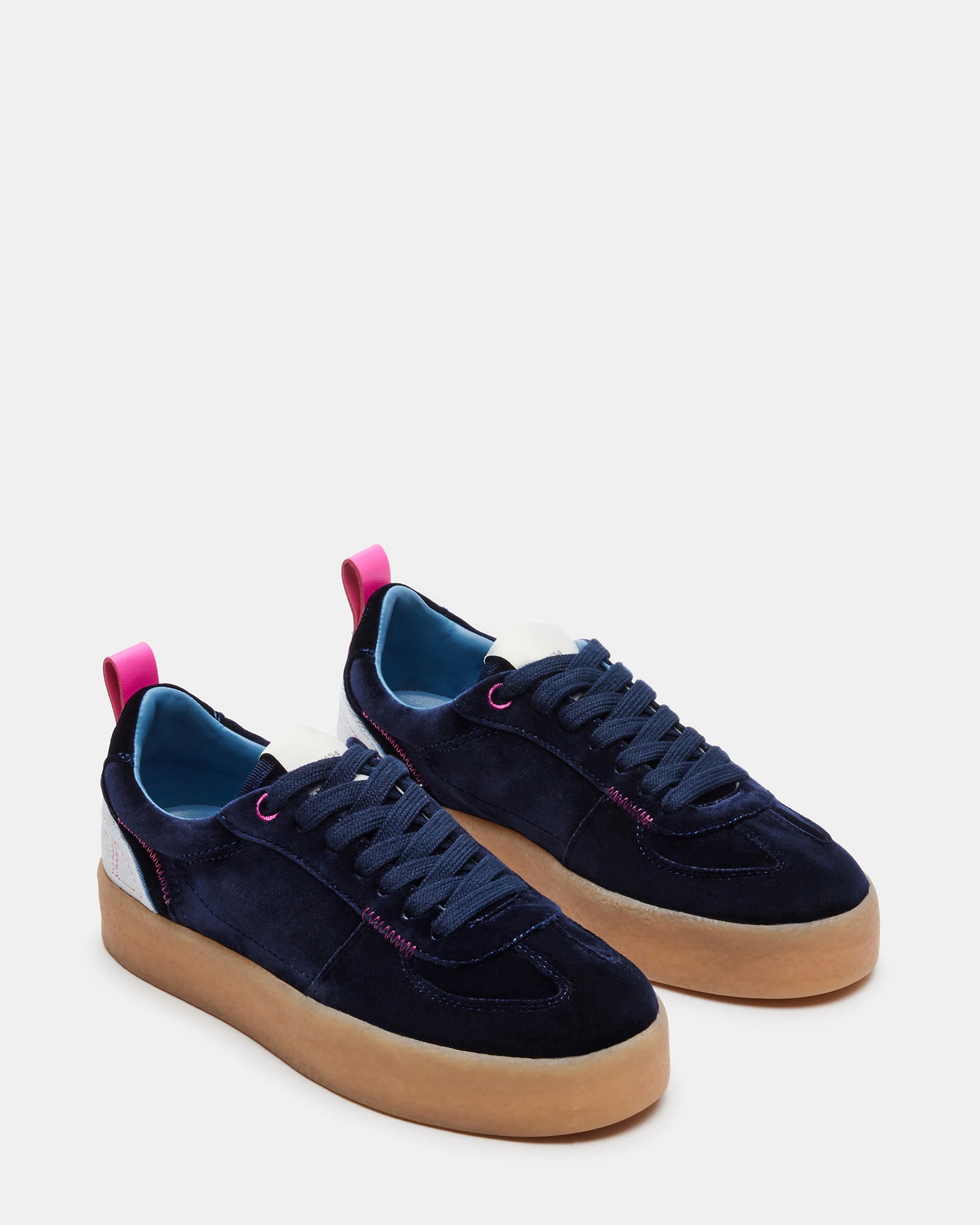 Tucker platform sneakers paired with casual outfit on city street.