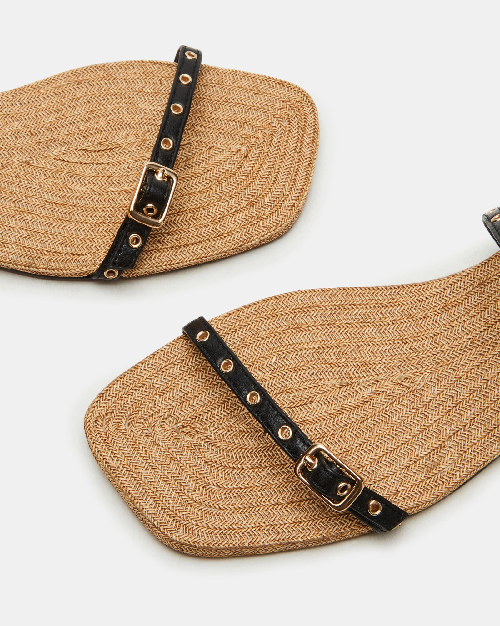 Stylish Tundra sandals worn on a sunny outdoor patio setting.