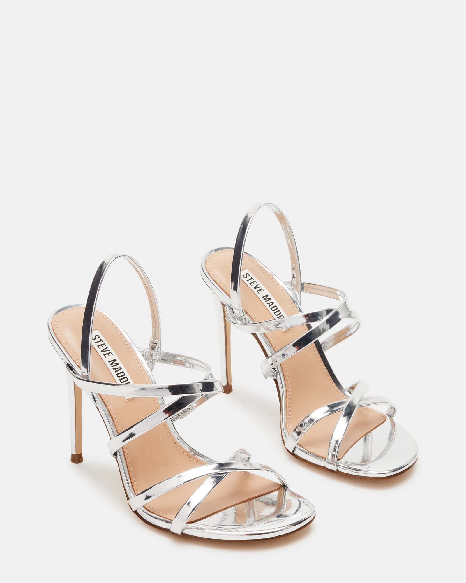 Close-up of Tylah silver platform heels showcasing the synthetic material.