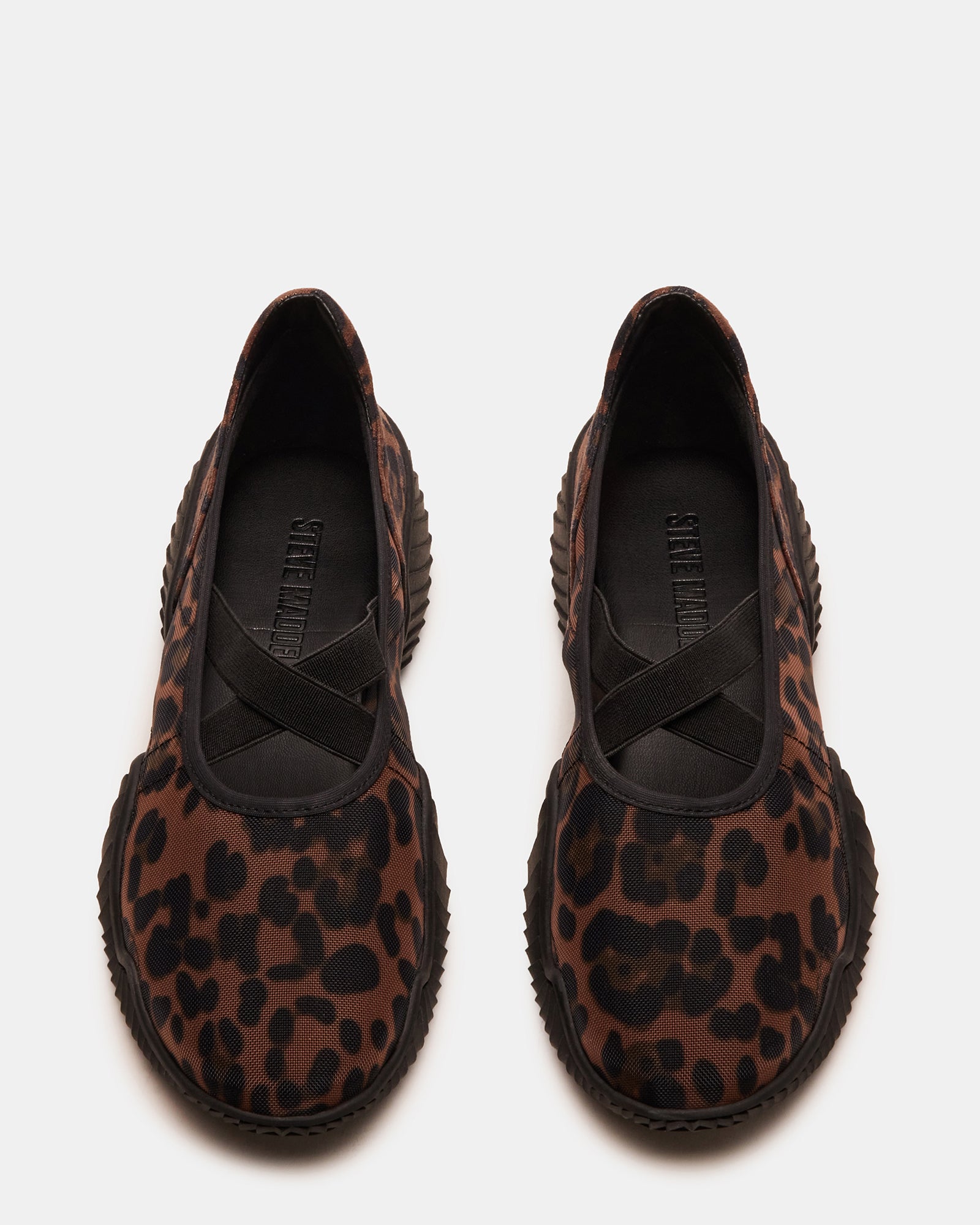 VADOR sneakers side profile showing leopard detail and mesh texture