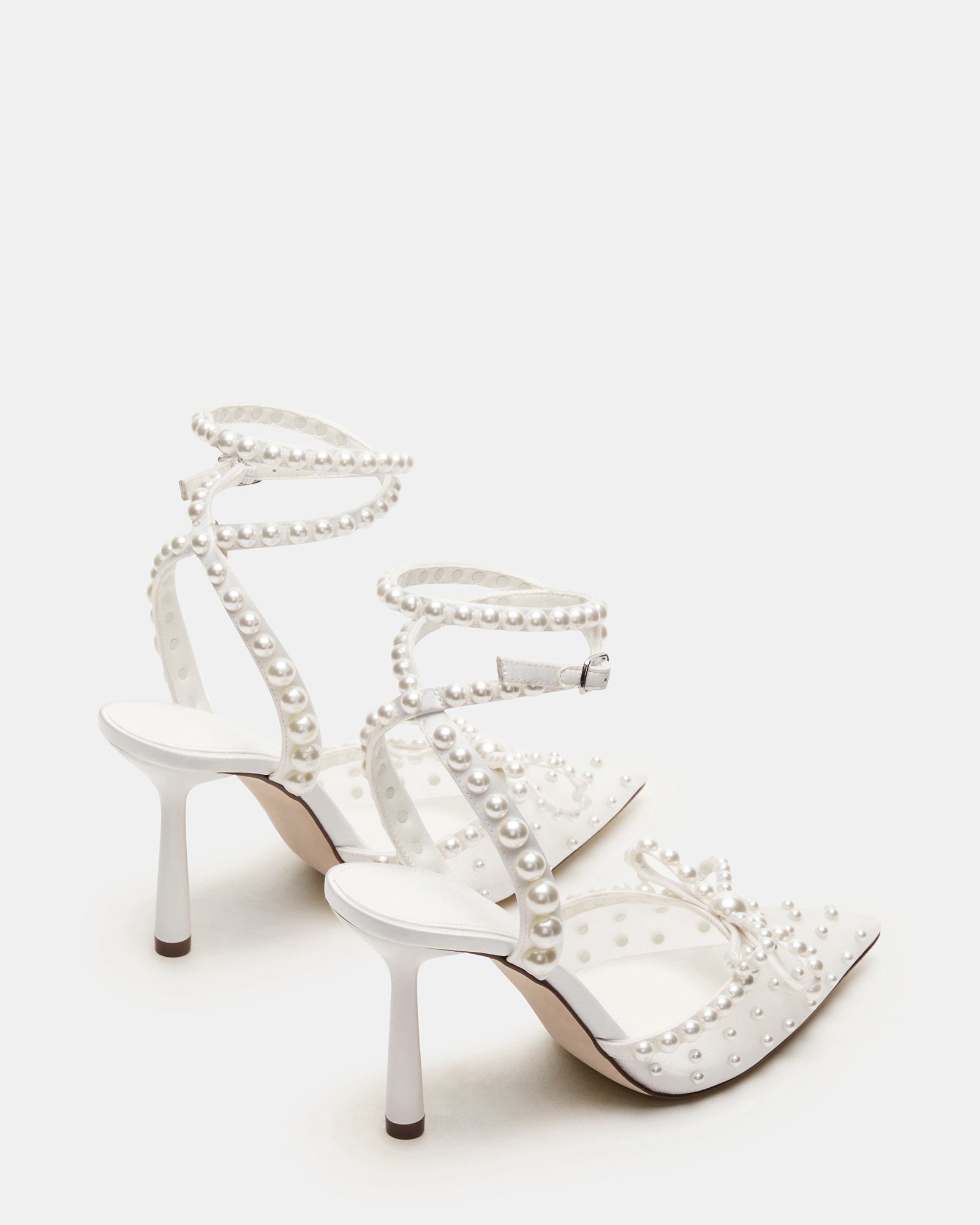 Fashionable pair of ivory heels with elegant embellishments for special occasions