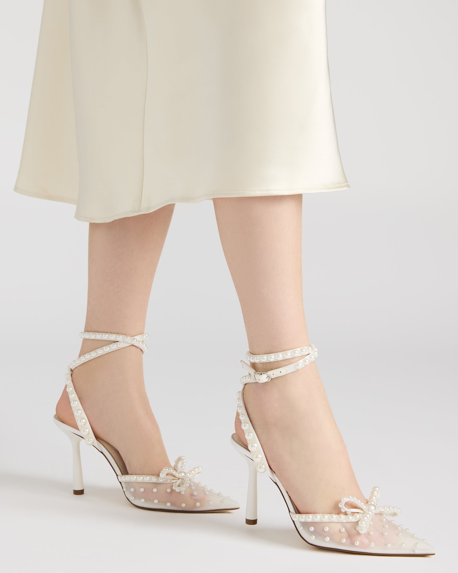 Close-up of the pointed toe design on VAL ivory heels