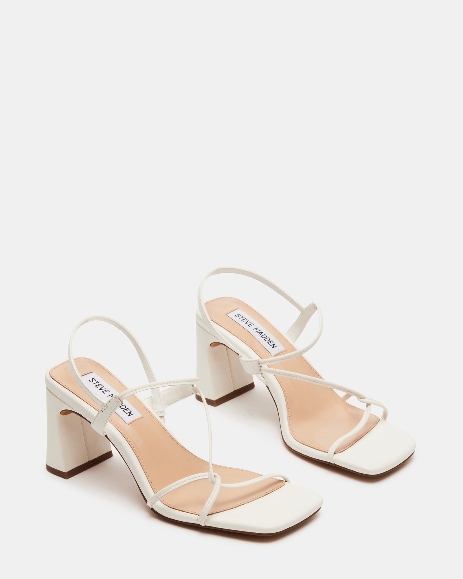 Close-up of Valora white leather heels highlighting the material.