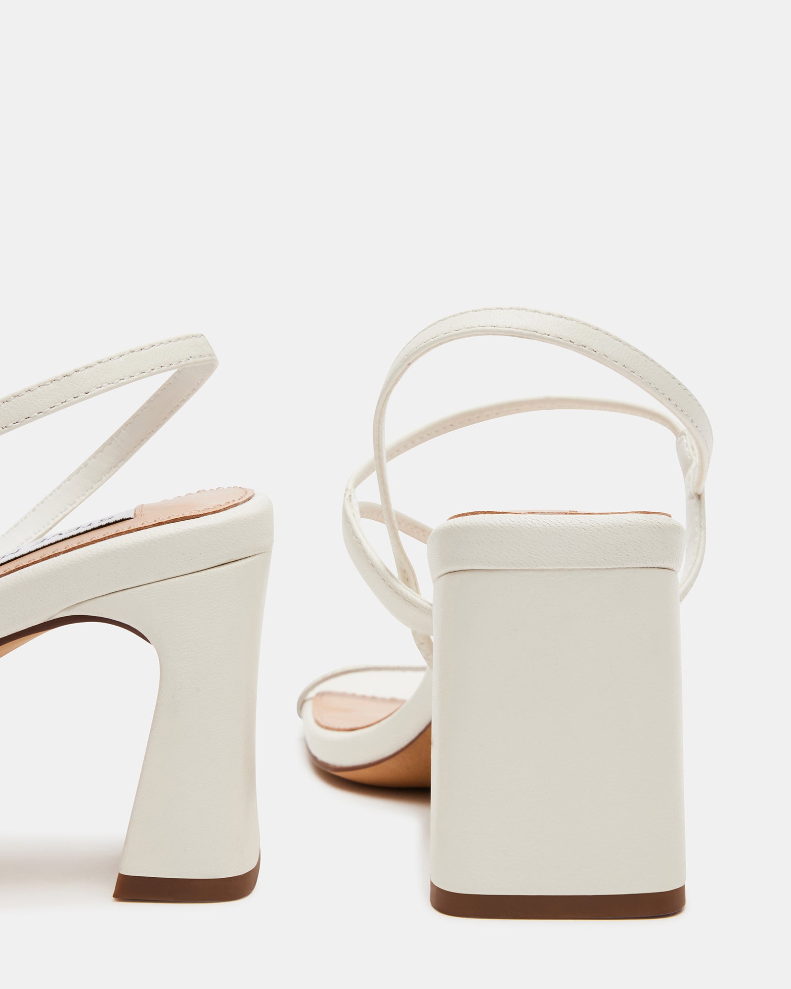 Elegant Valora white kitten heels angle view on display.