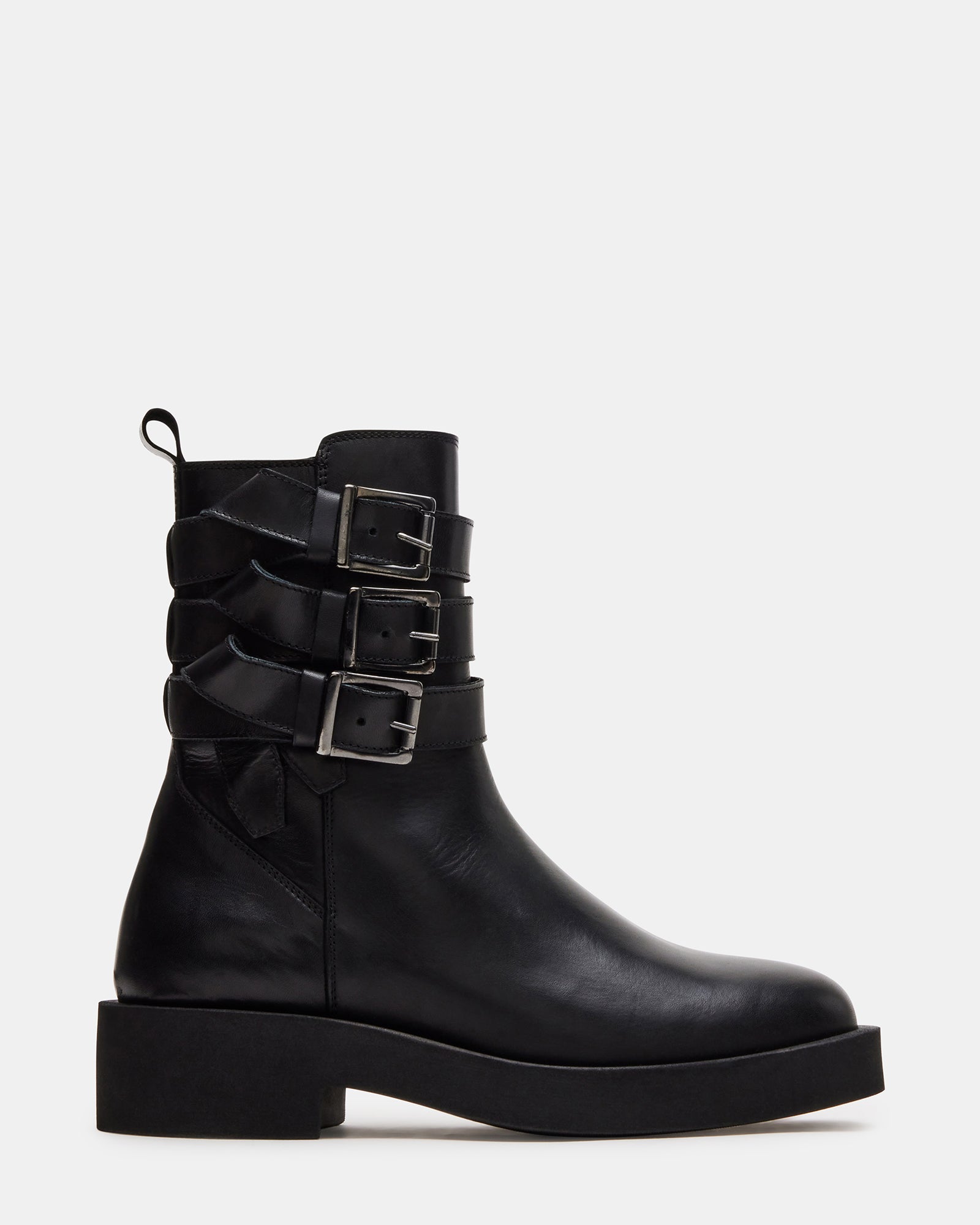 Close-up of VANDAL black combat boots showing leather texture and buckle accents
