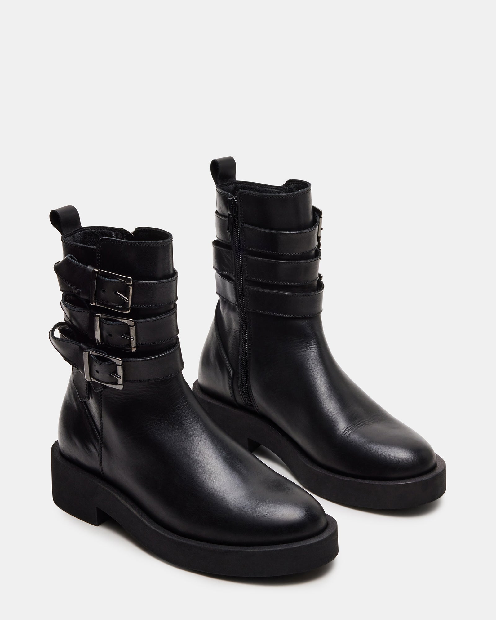 Side view of womens moto boots paired with skinny jeans for street-style inspiration