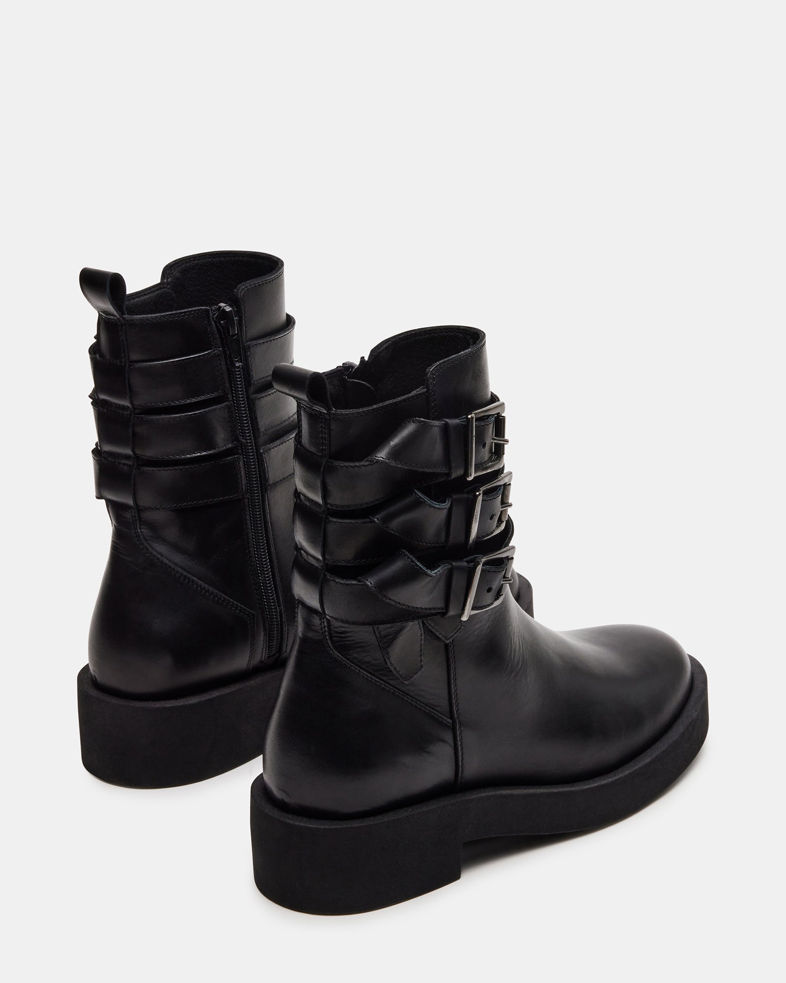 Side view of womens moto boots paired with skinny jeans for street-style inspiration