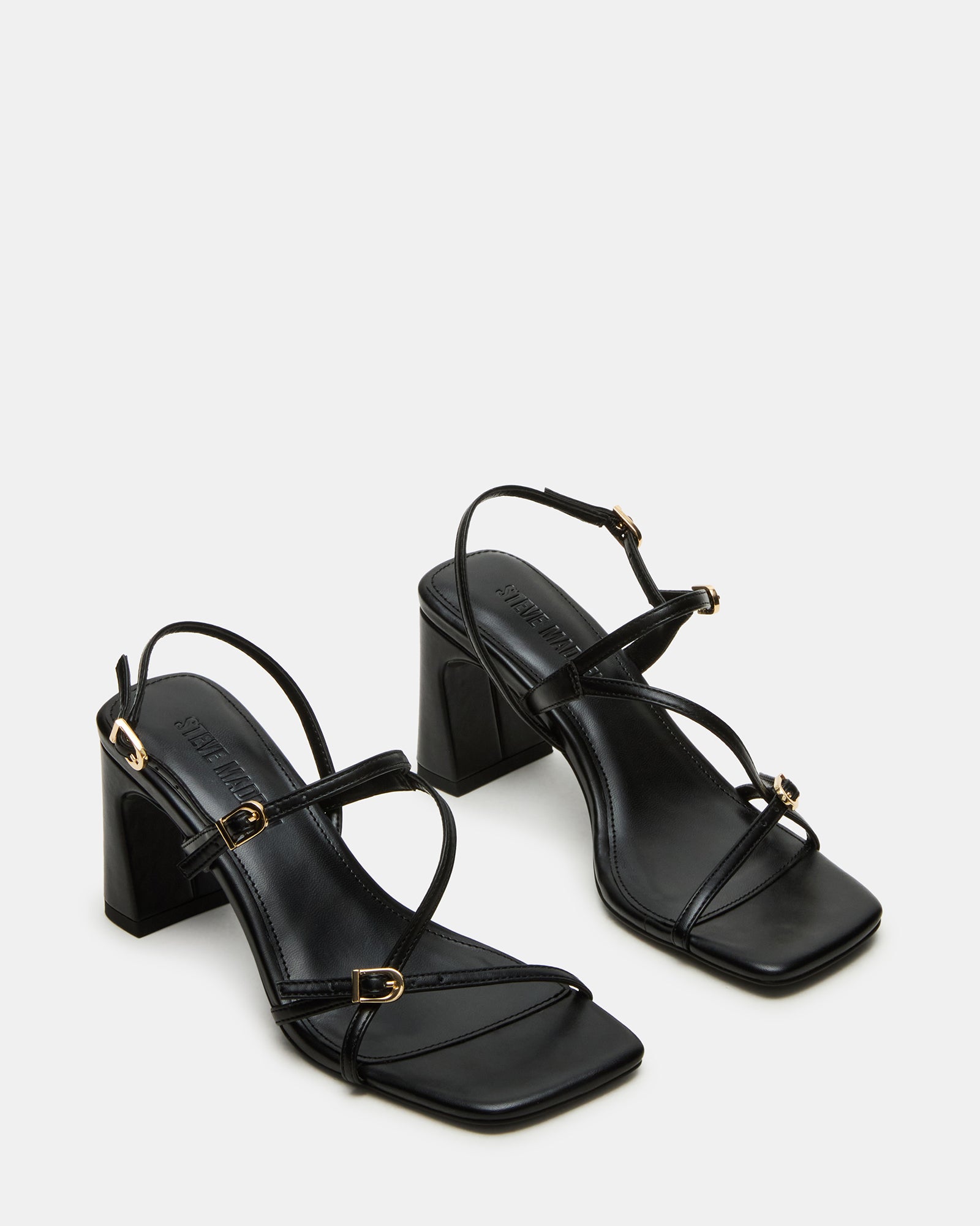 Worn black suede slingback heels perfect for a night out.