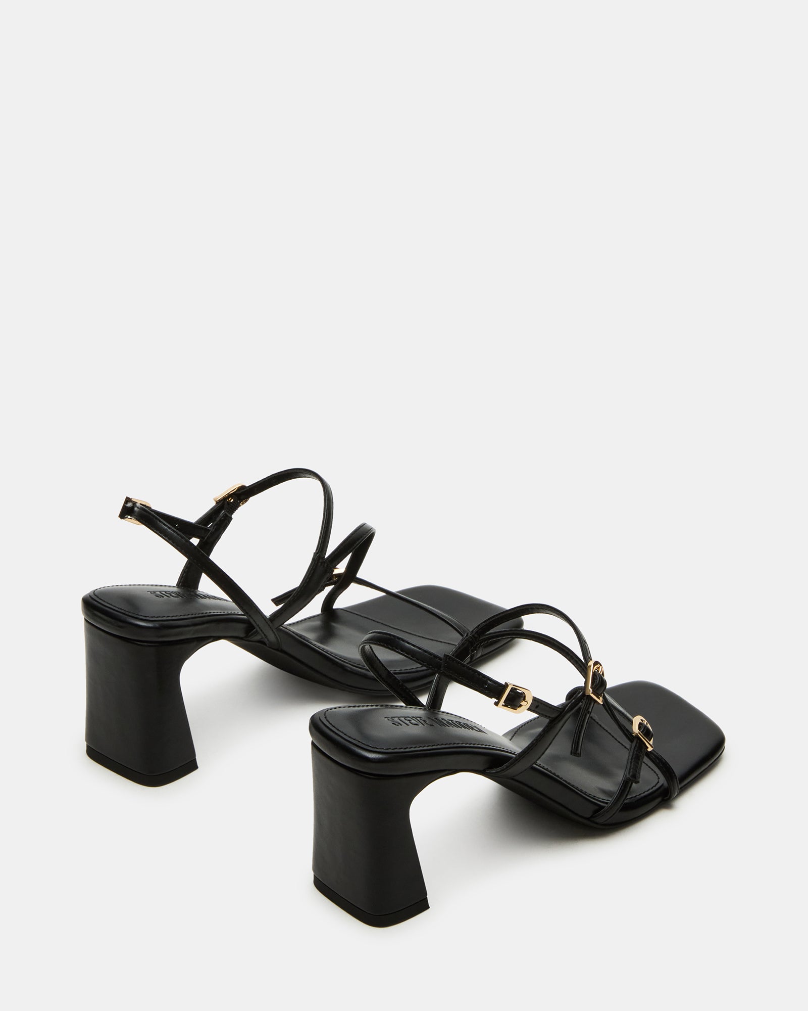Worn black suede slingback heels perfect for a night out.