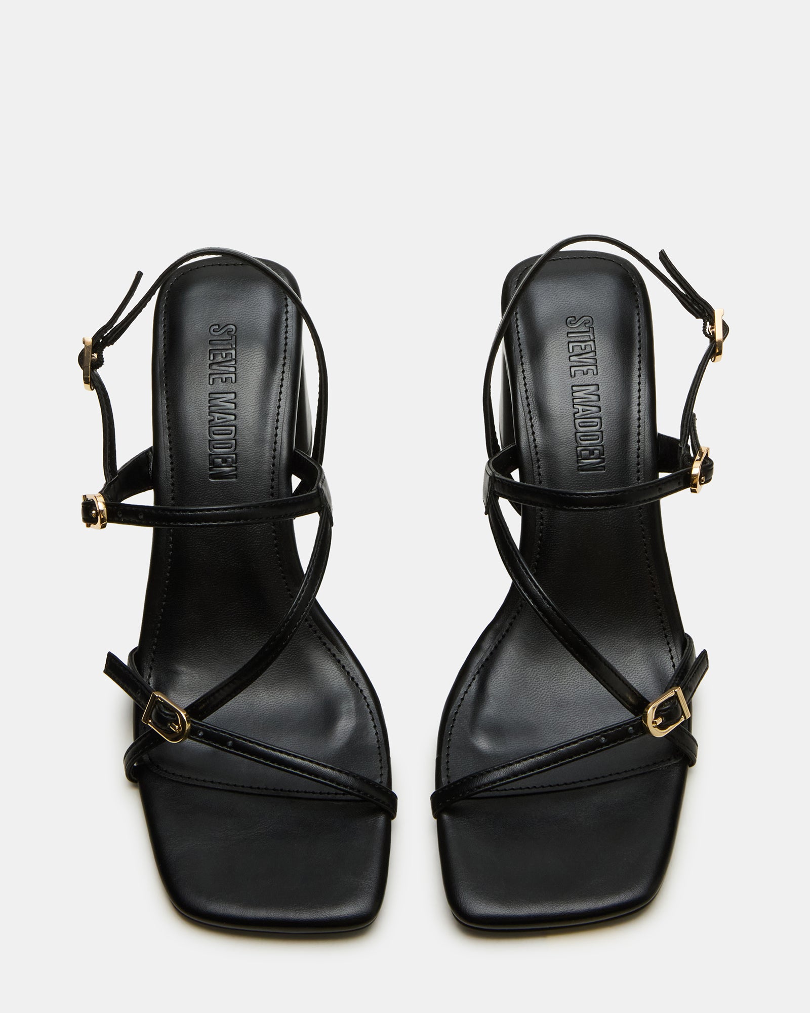 Close-up of vegan leather black square toe heels with modern design.