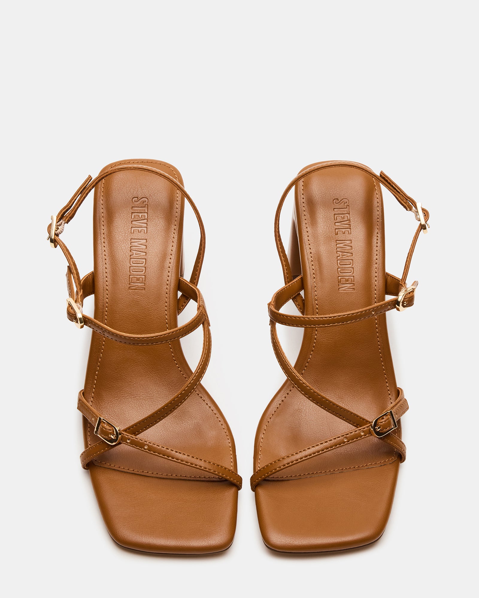 Elegant Caramel Slingback Heels with buckle, ideal for day-to-night wear.