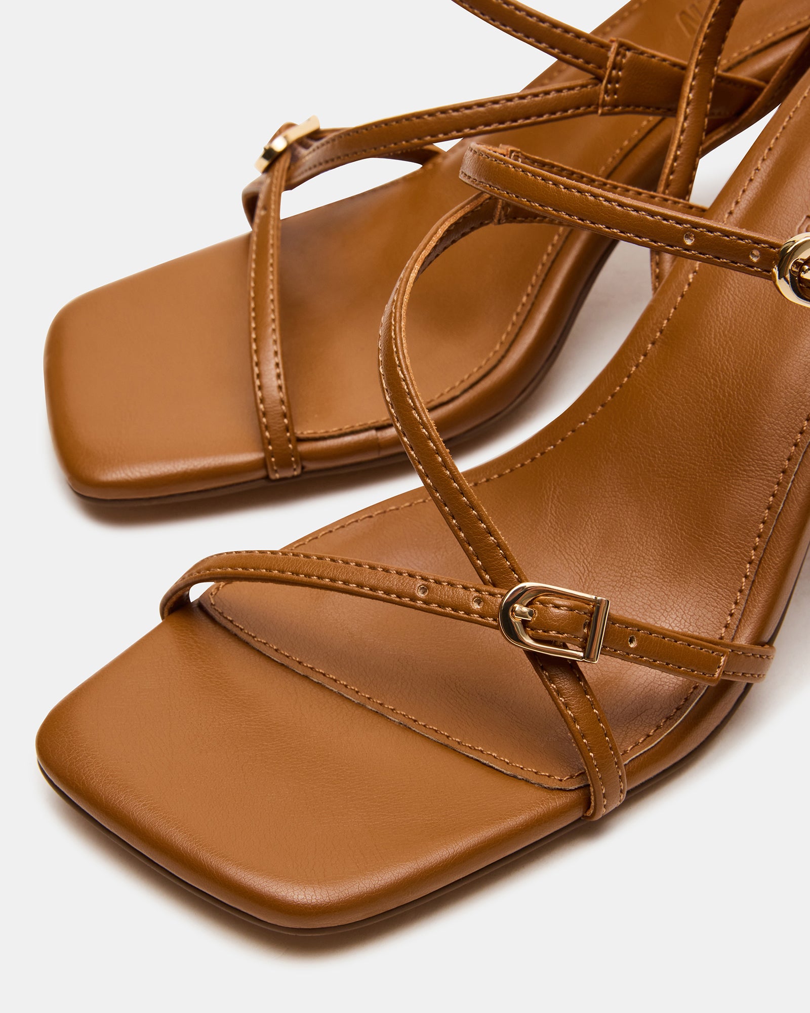 Side view of nude slingback heels showcasing their sophisticated design.