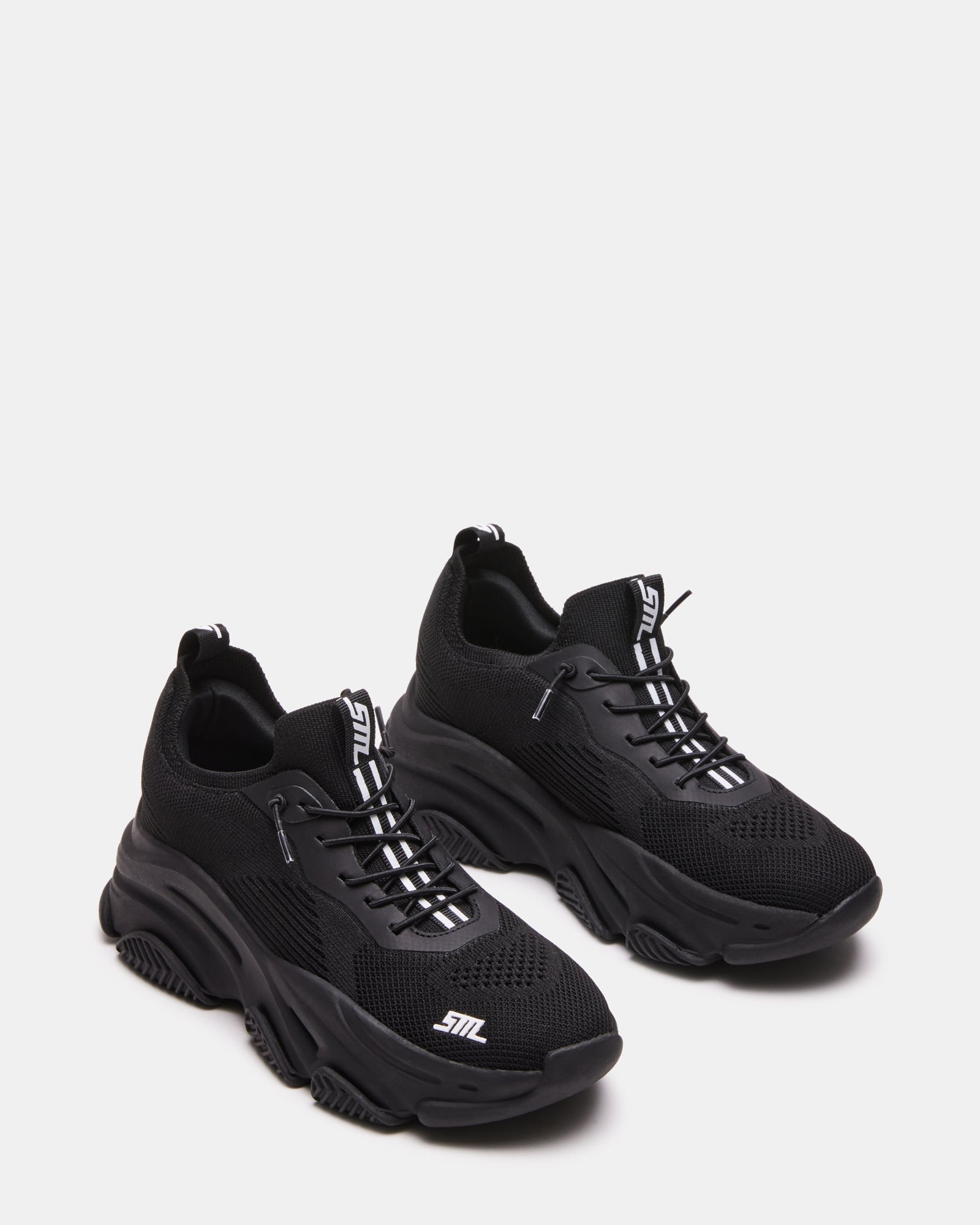 Person walking in VAULT sneakers highlighting sole flex