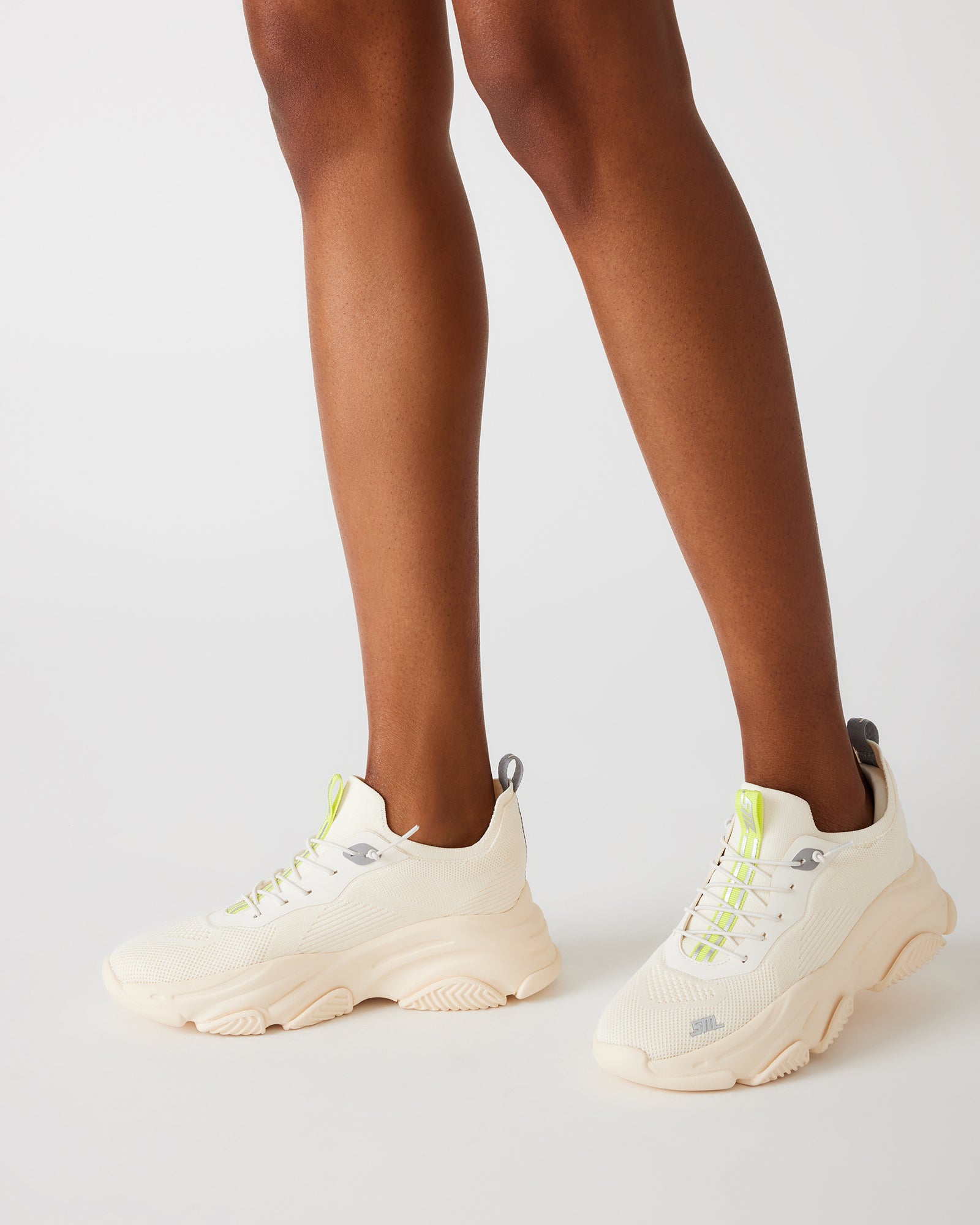 Comfort Fusion Lace-Up Sneakers worn during a casual outing, showcasing their versatility.