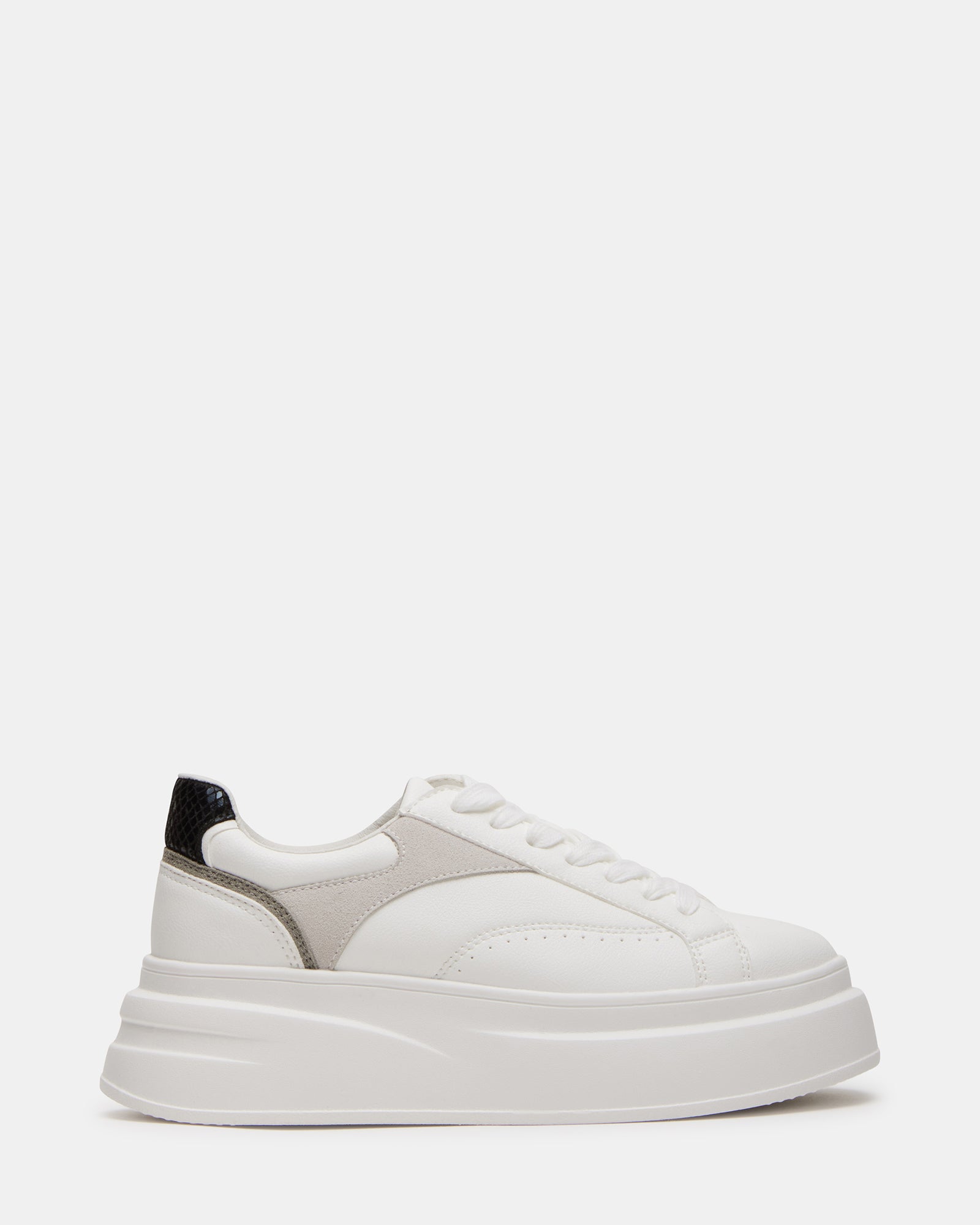 White vegan leather sneakers from a side angle, showcasing the platform sole