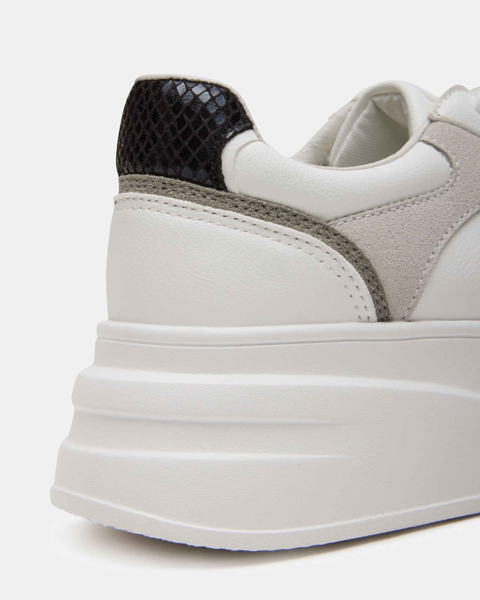 Venture sneakers paired with dark denim for a styled look