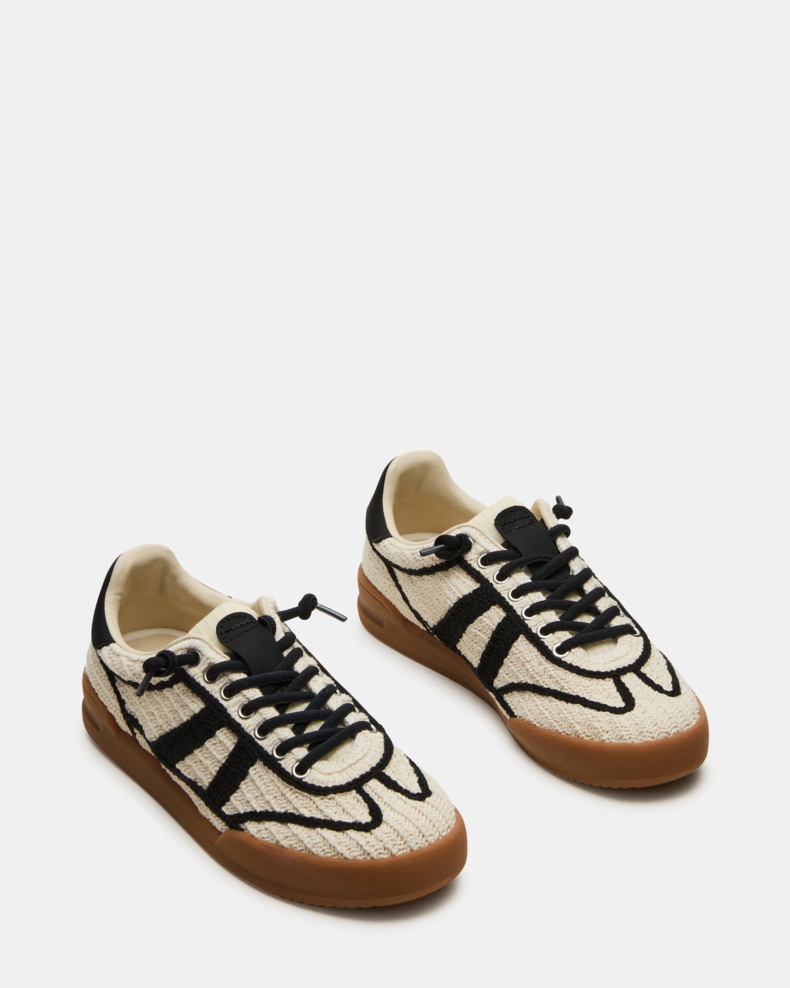 Close-up of the sneakers lace closure and textile lining for comfort