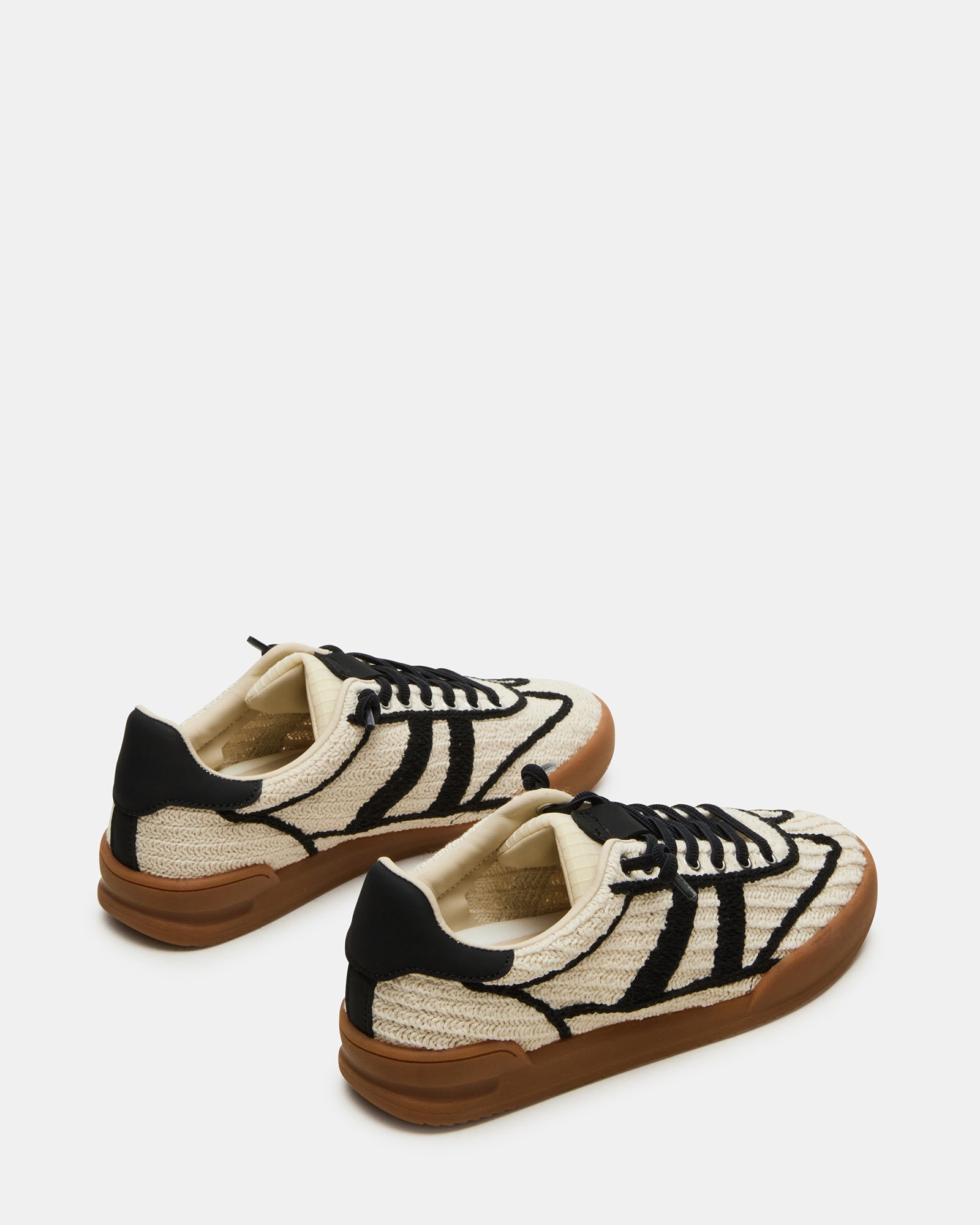 Close-up of the sneakers lace closure and textile lining for comfort
