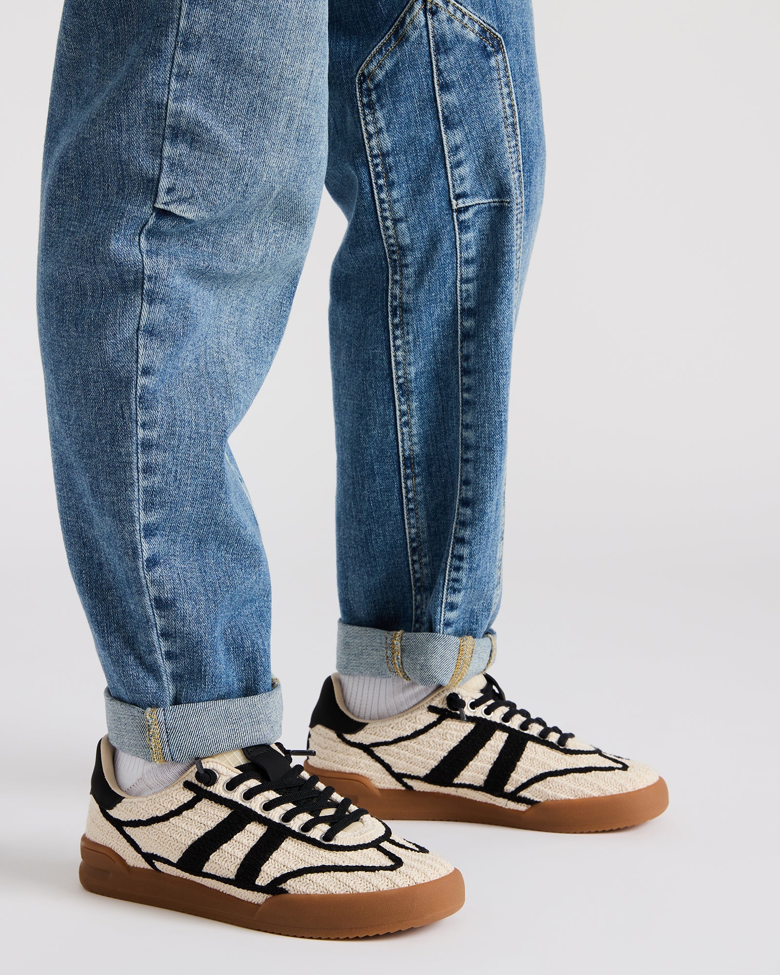 Front view of the low-top lace-up sneakers with stylish crochet pattern