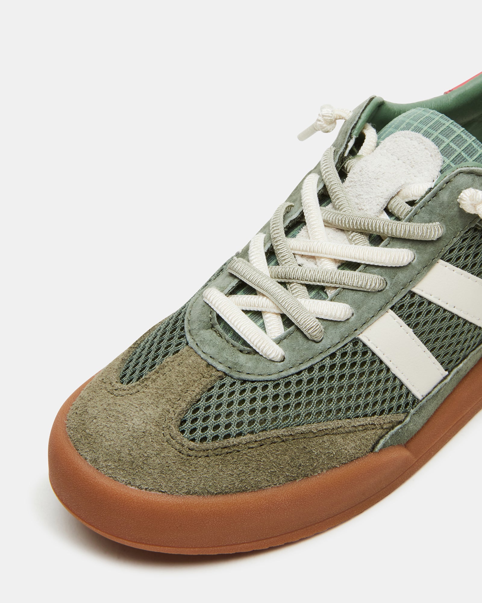 Sneakers and belt bag set displayed together, ideal for casual outfits.