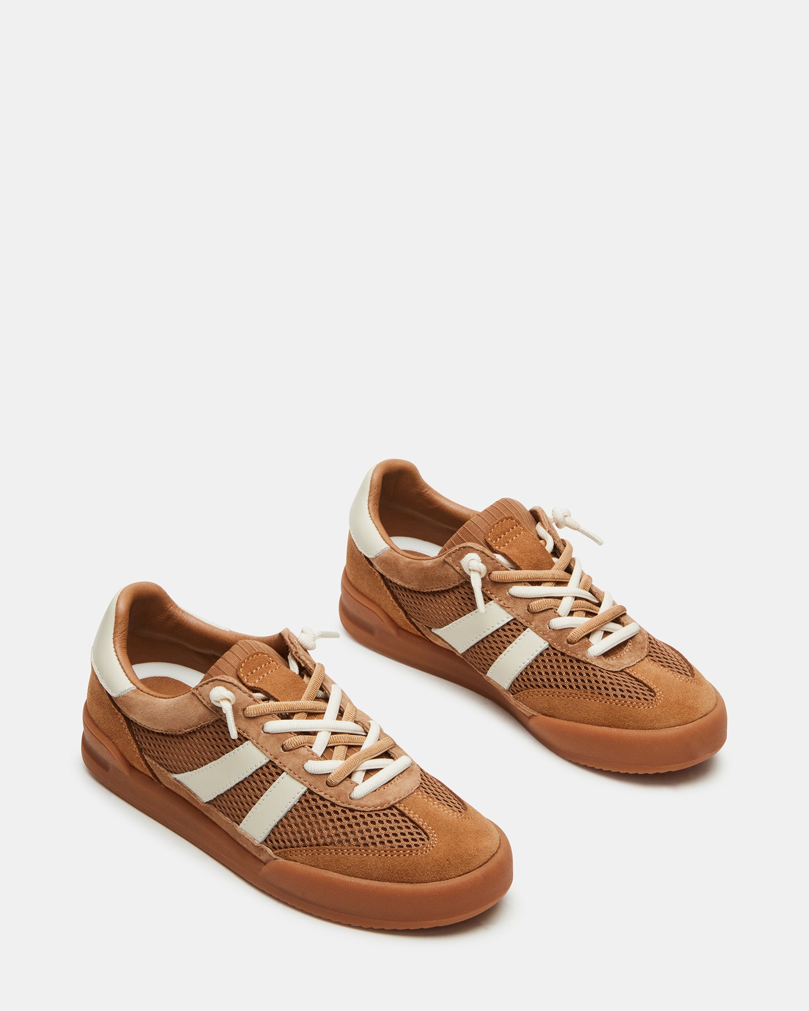 Lifestyle photo of sneakers worn with casual jeans, showing the textured material mix