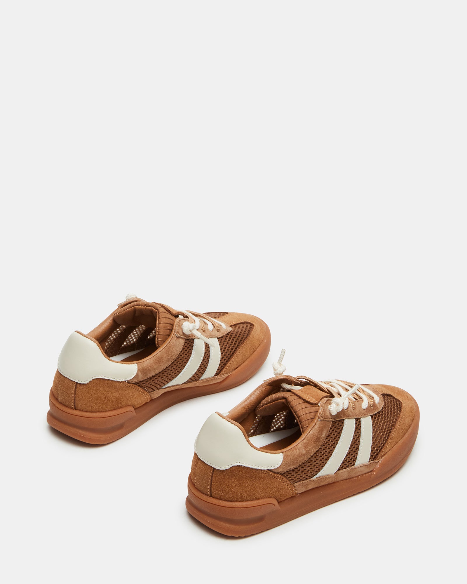 Lifestyle photo of sneakers worn with casual jeans, showing the textured material mix