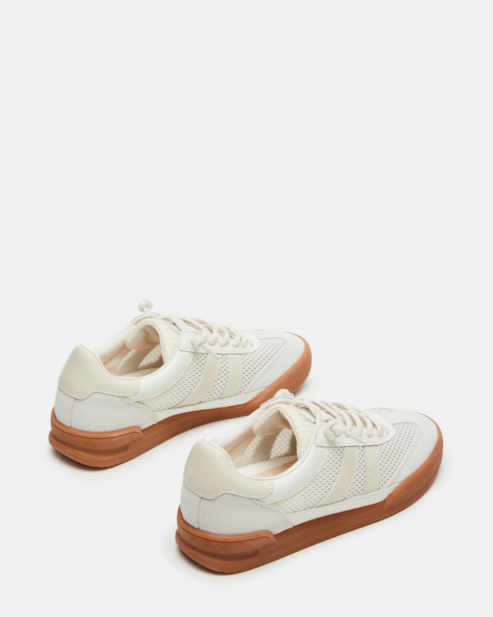 White sneakers styled with jeans and a casual outfit for everyday use
