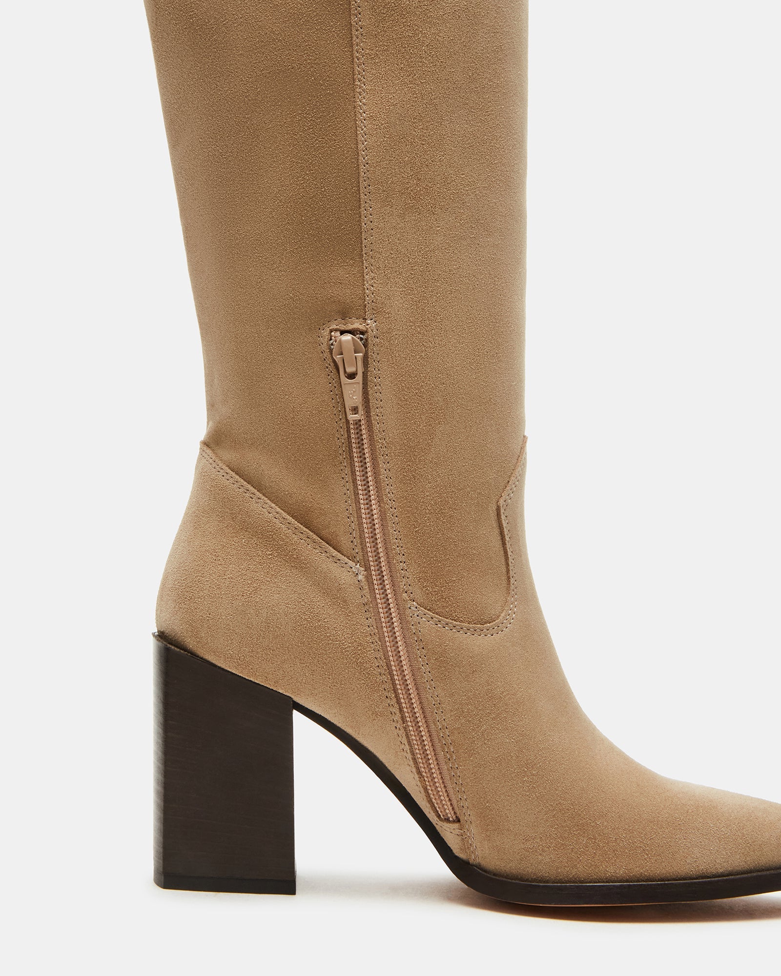 Woman wearing wide calf knee-high boots with jeans