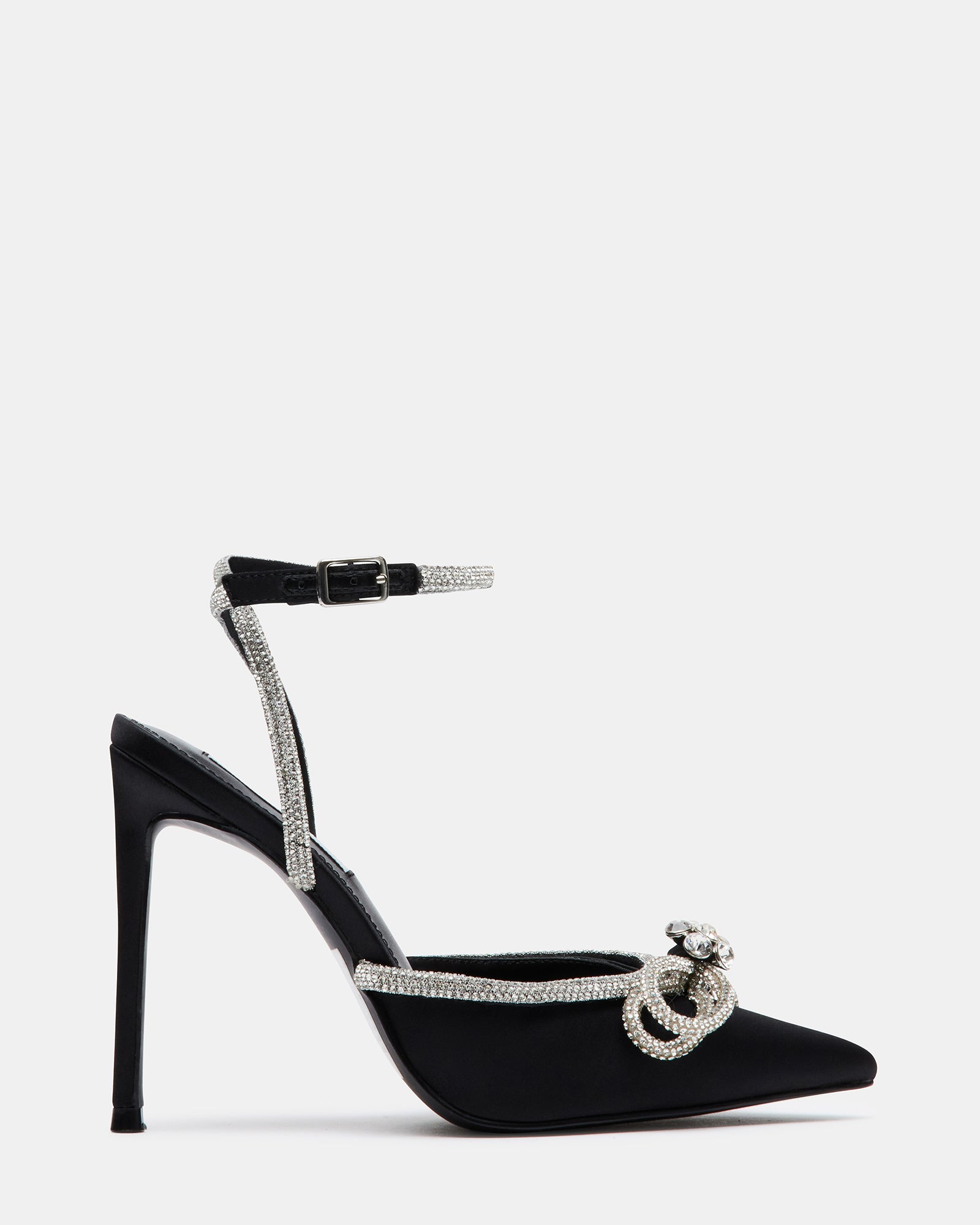 Side angle of black stiletto heel with glittering ankle strap on marble surface.