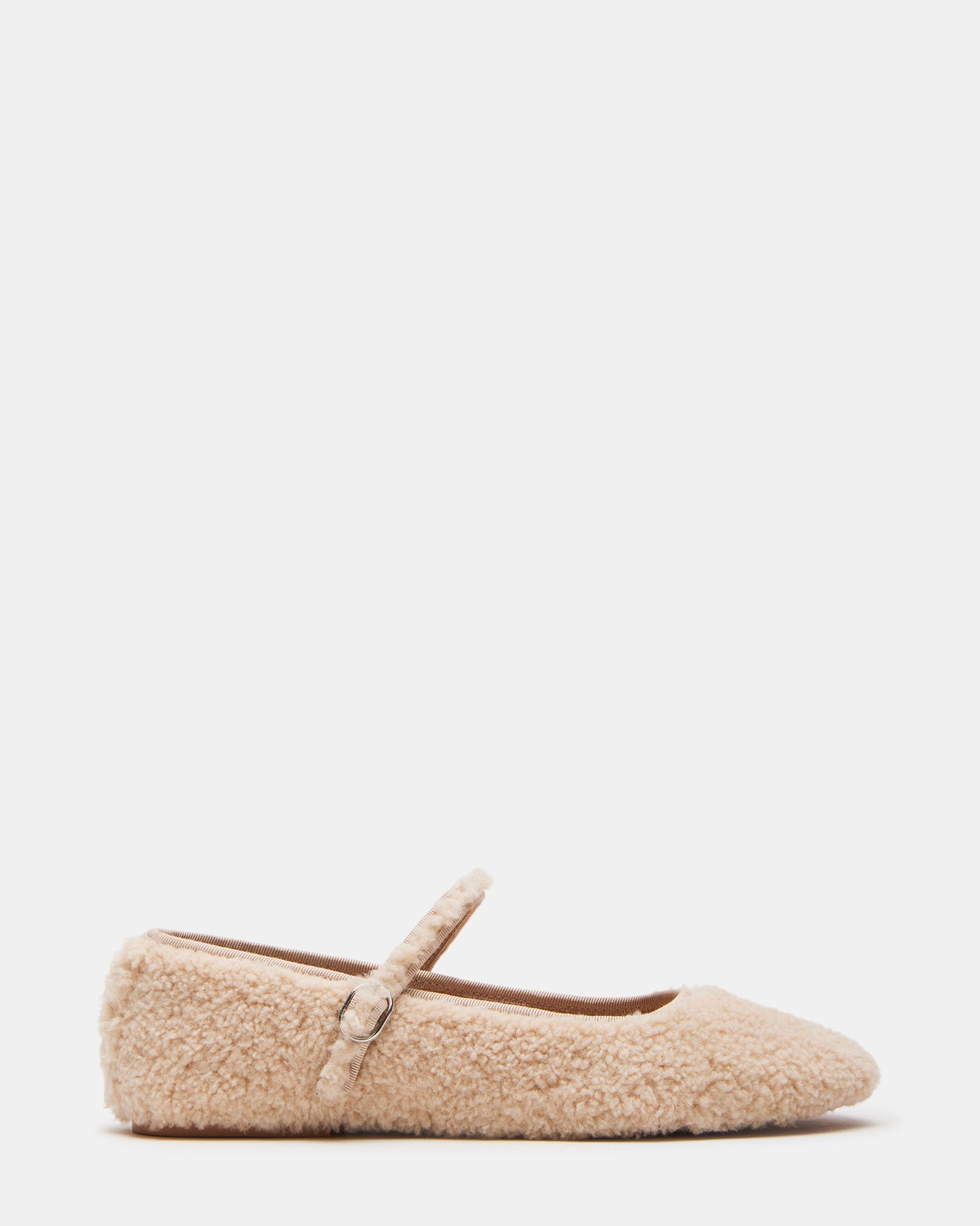 Side view of faux shearling Mary Jane shoes showing buckle detail