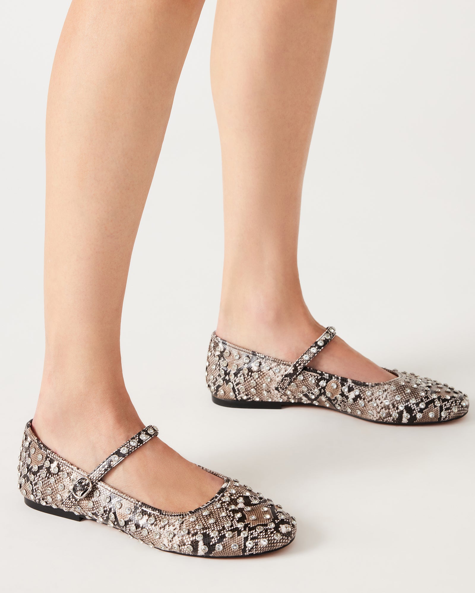 Close-up of flat back rhinestones on vegan leather upper