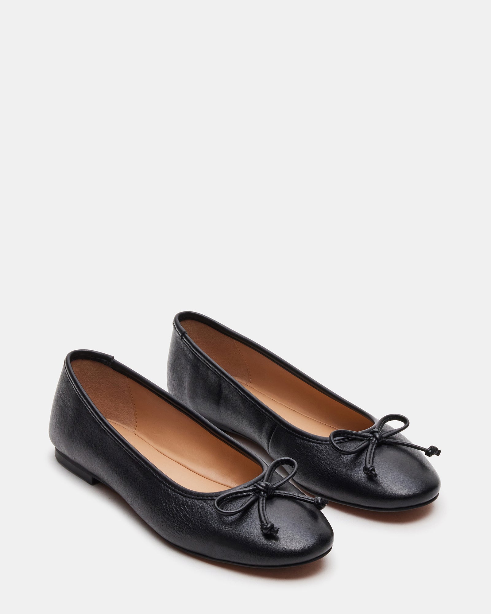 Ballet flats paired with a dress for elegant occasions.