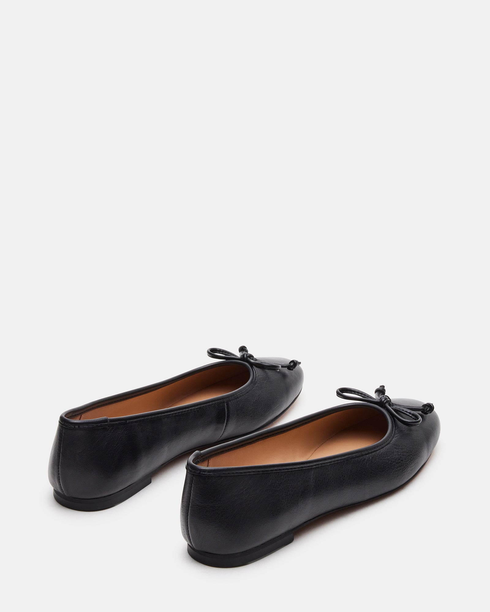 Ballet flats paired with a dress for elegant occasions.