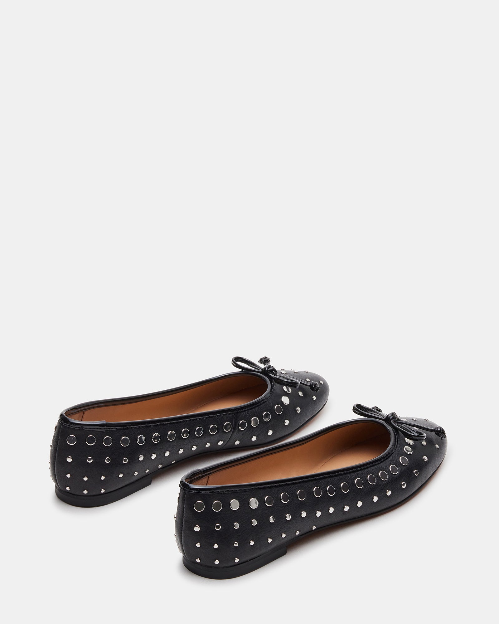 Side profile of stylish womens ballet flats with hardware embellishments