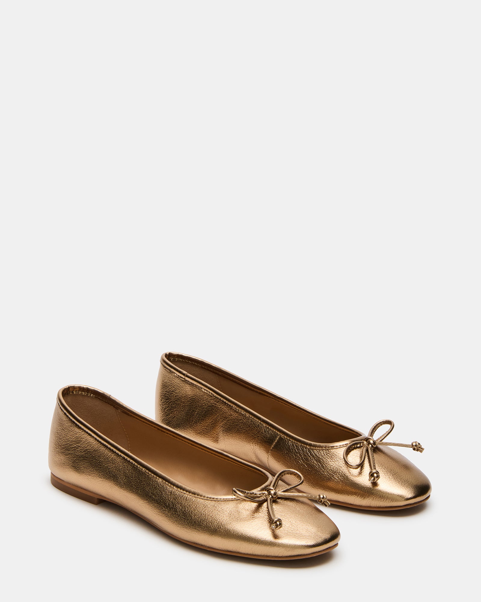 Side profile of black ballet flats showing rounded toe